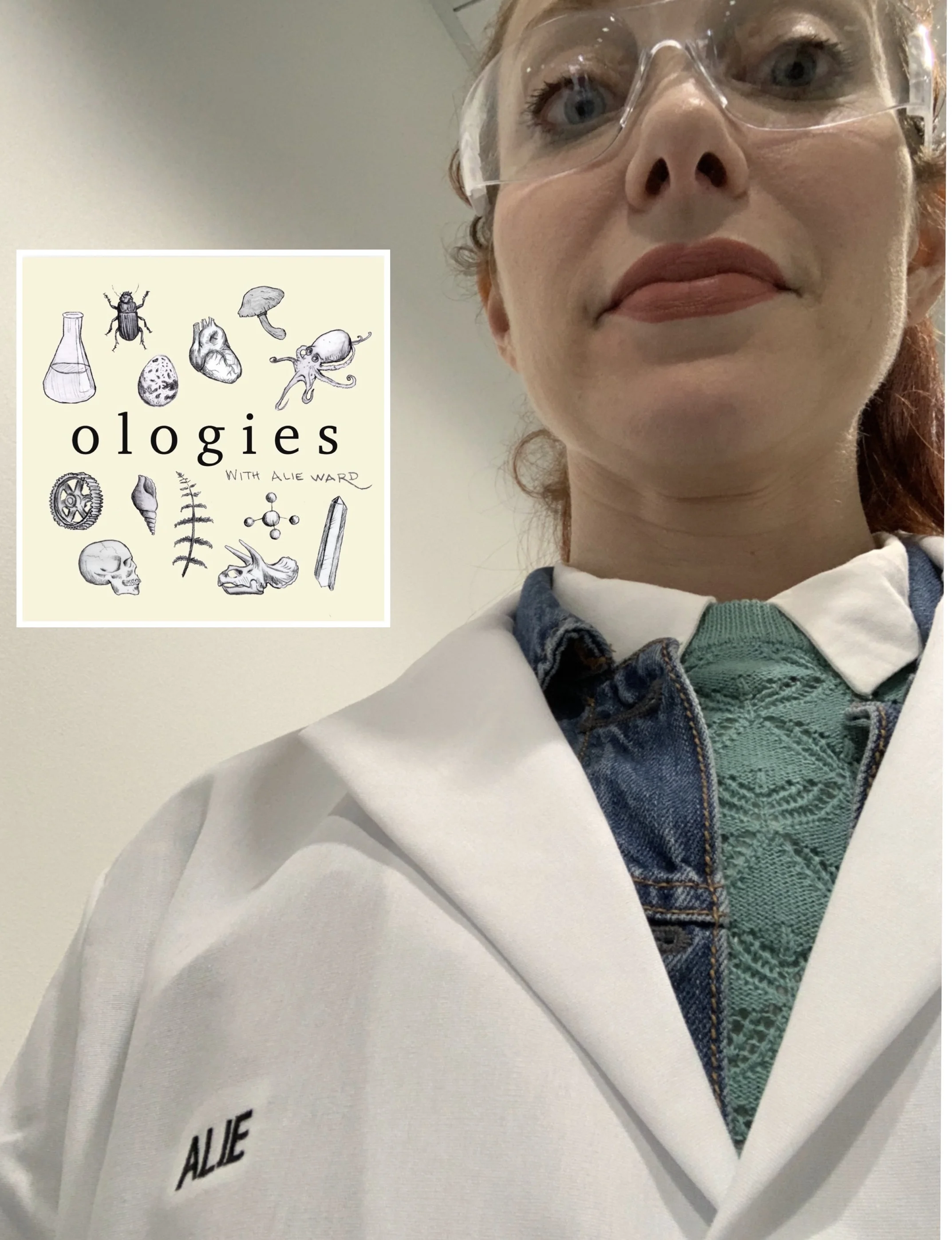 An uncomfortably large photo of Alie Ward (me) in a lab coat. I’m sorry you can see right up my nostrils.