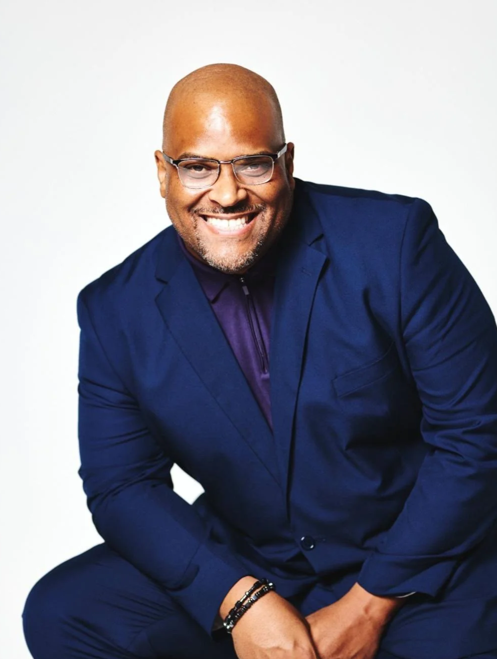 Image of coach Anthony Sharp looking good in a blue suit.