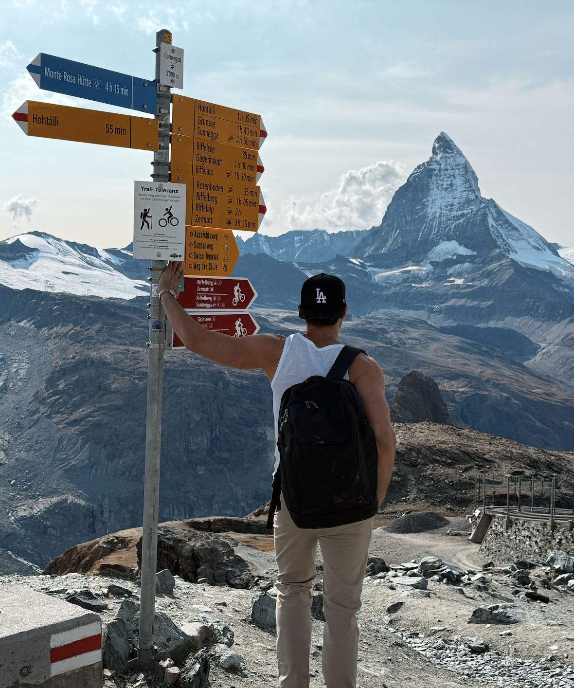 Life coach Kaden James stands before the Matterhorn in Switzerland, reflecting the journey of self-discovery, courage, and authentic personal growth. This image represents the power of choosing your own path, reclaiming confidence.
