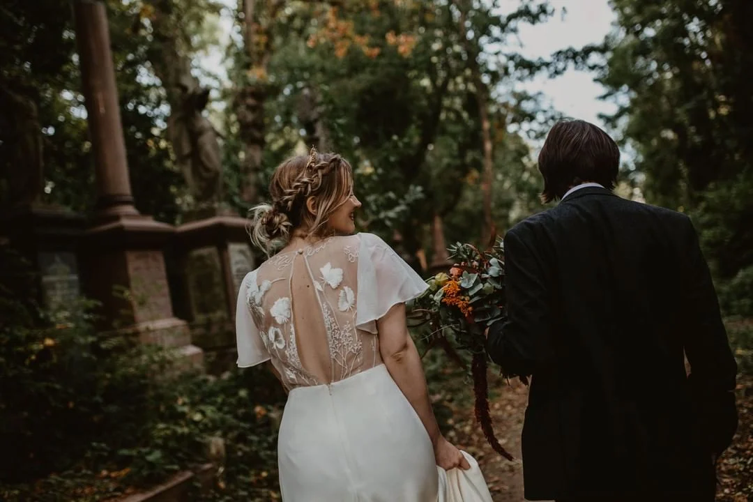 Sophie wears ‘Delilah’ by Story of My Dress , personalised with Lily of the Valley flowers to represent her Granny. Photography by Camilla Andrea Photography
