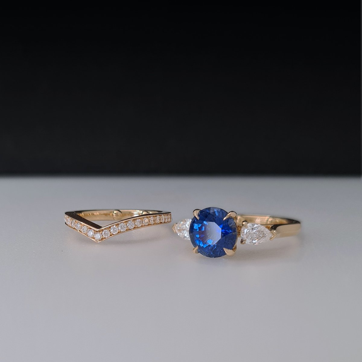 8b_ Sapphire and pear diamonds engagment ring with matching wishbone wedding band ©Amanda Li Hope.jpg