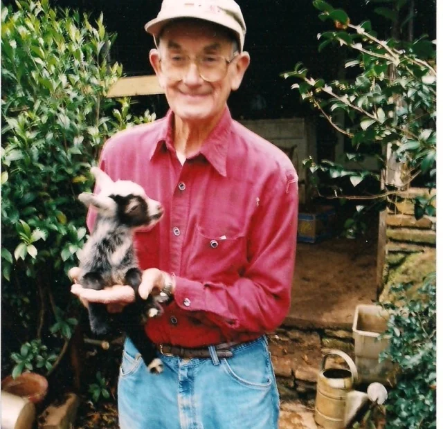 Mr. Ora Coleman with one of his baby goats