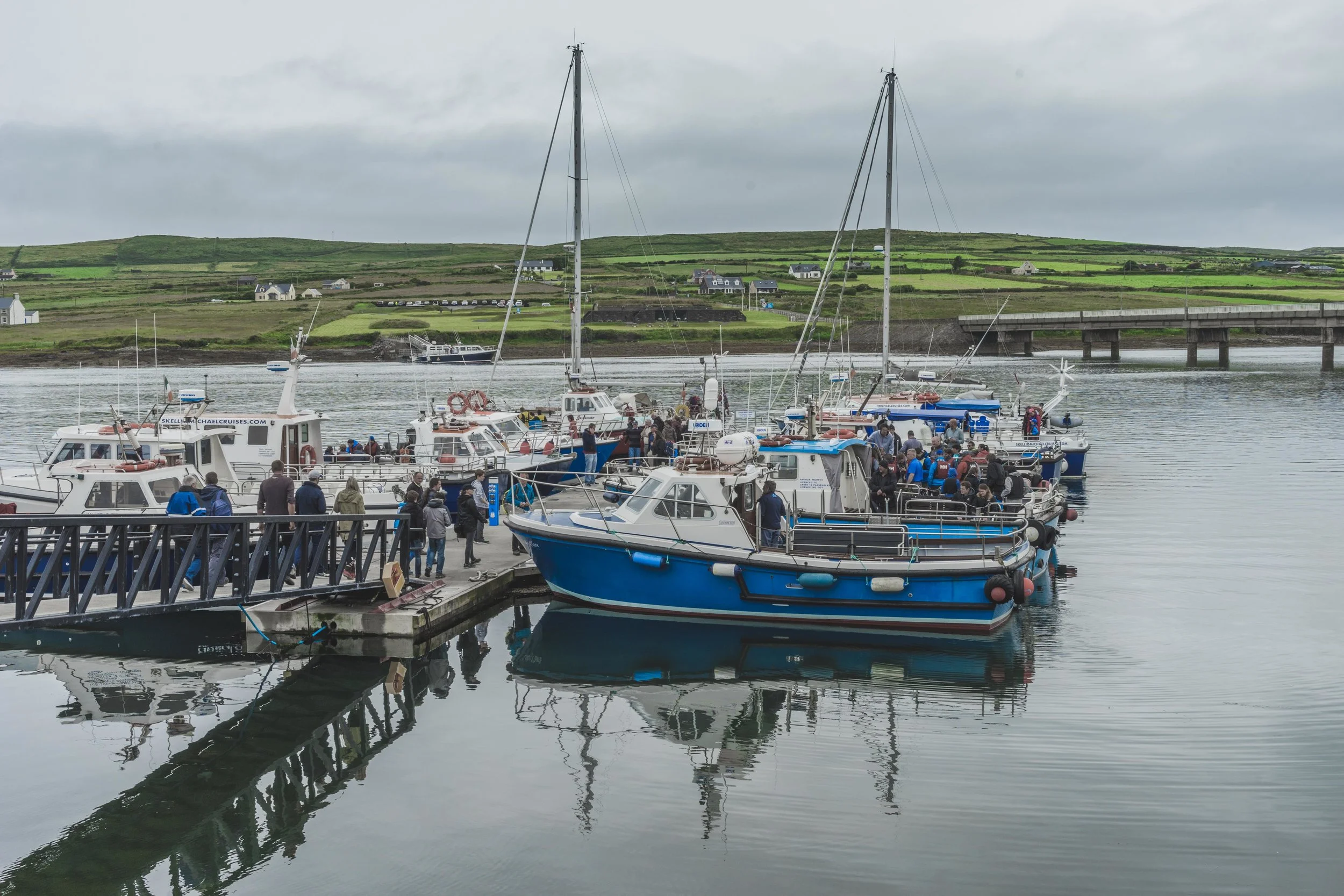Portmagee harbor with blue boats