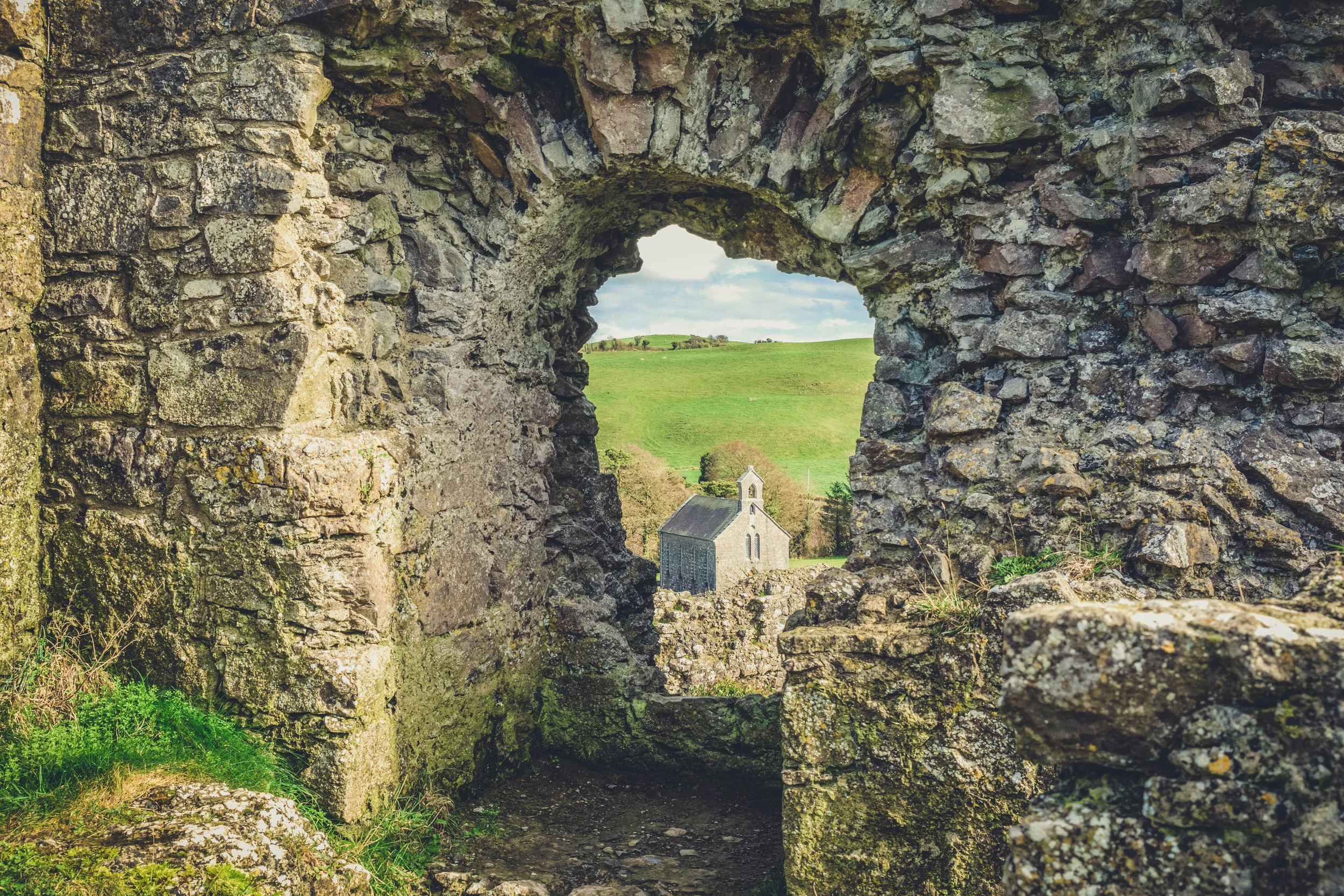 Ireland. Castle. Old castle. irish history. history. Rock of Dunamase. blue sky. rock. pathway. adventure. travel. irish counrty. green fields. castle archway. old church.jpg