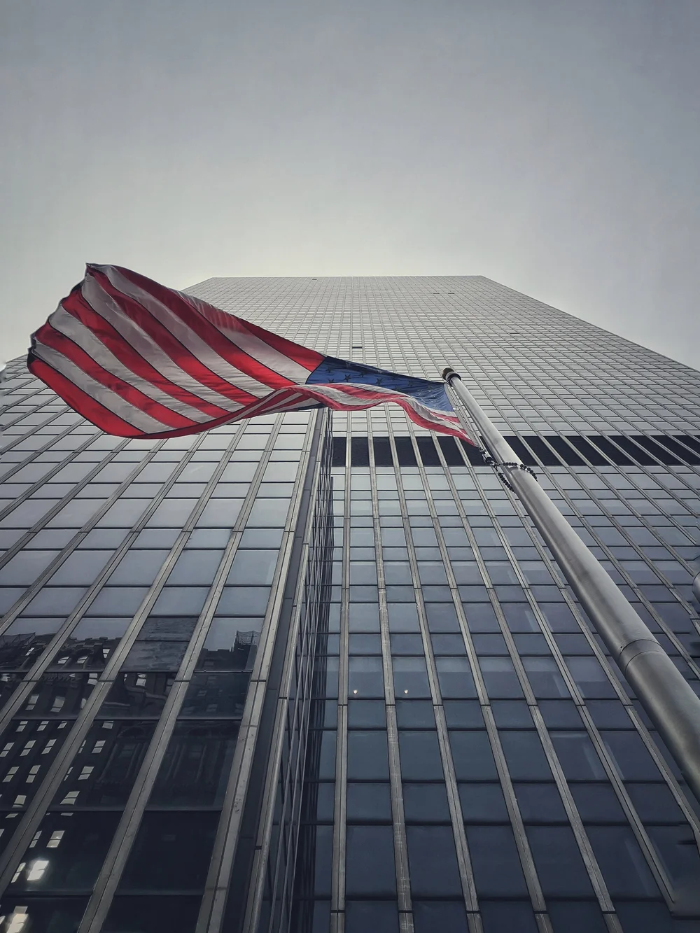 USA flag and tall new york building.jpeg