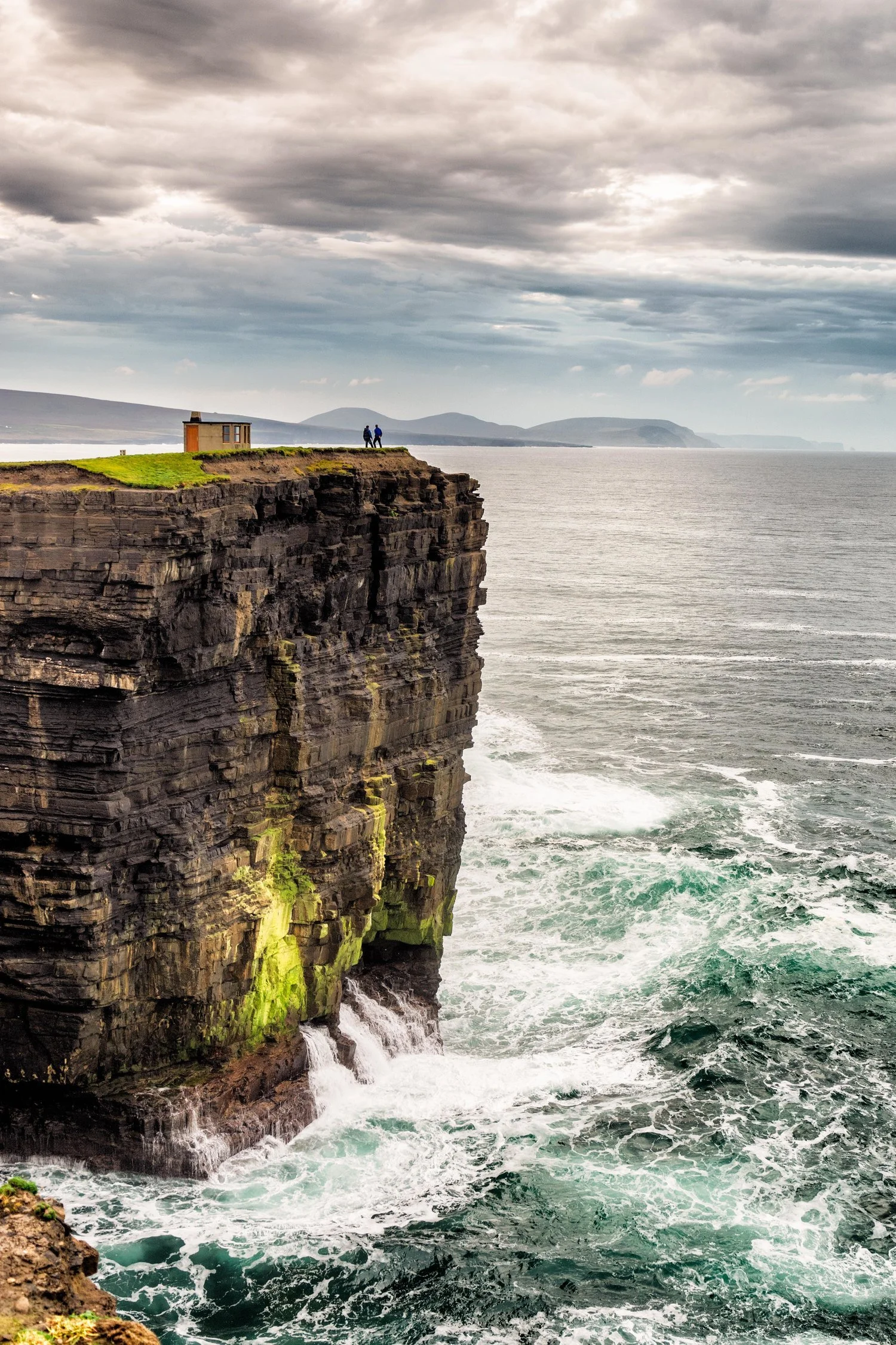 two+adventurers+on+the+cliff+edge.jpg