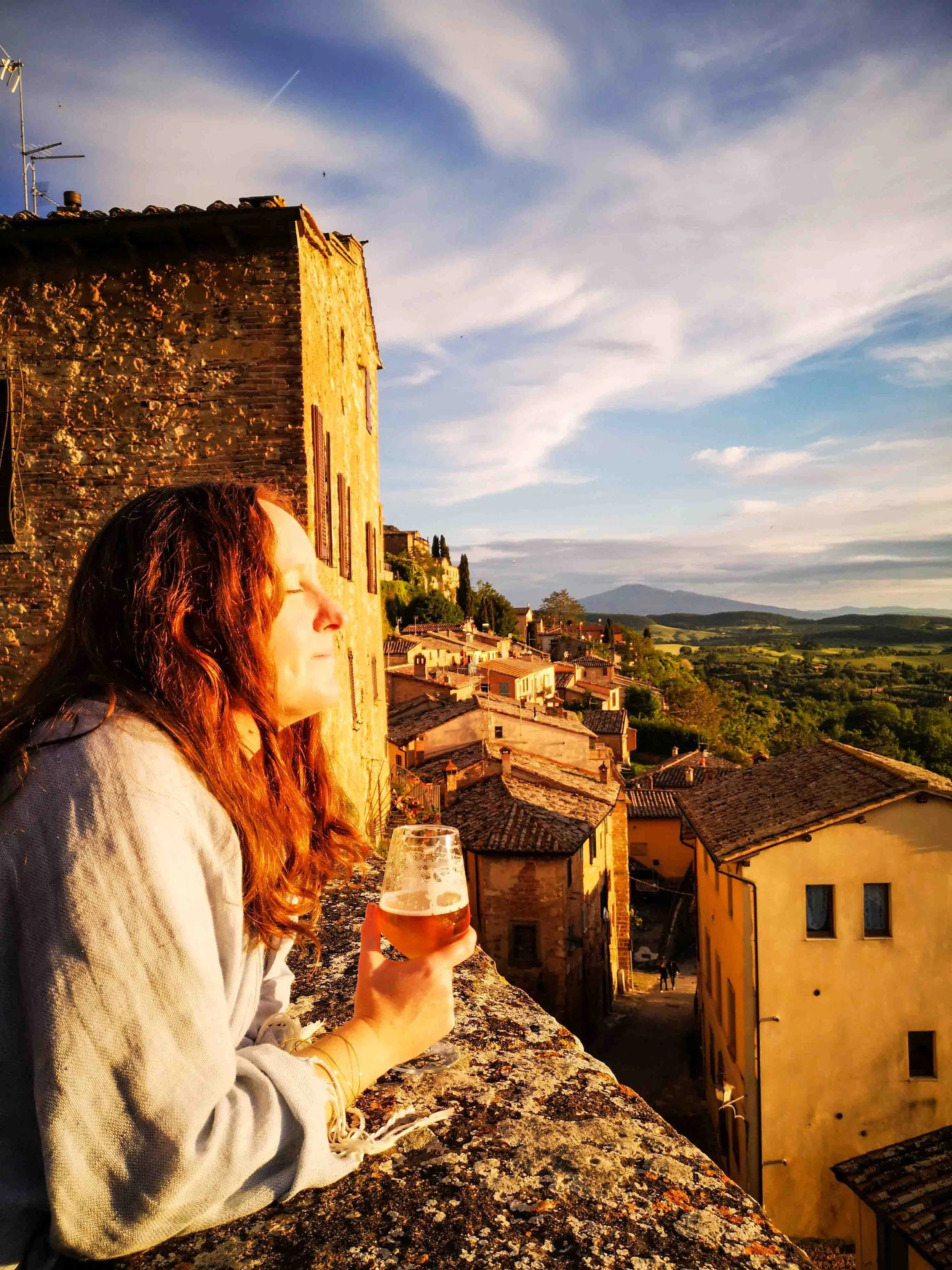 Soaking in the sun with a beer Montepulciano Tuscany road trip.jpg
