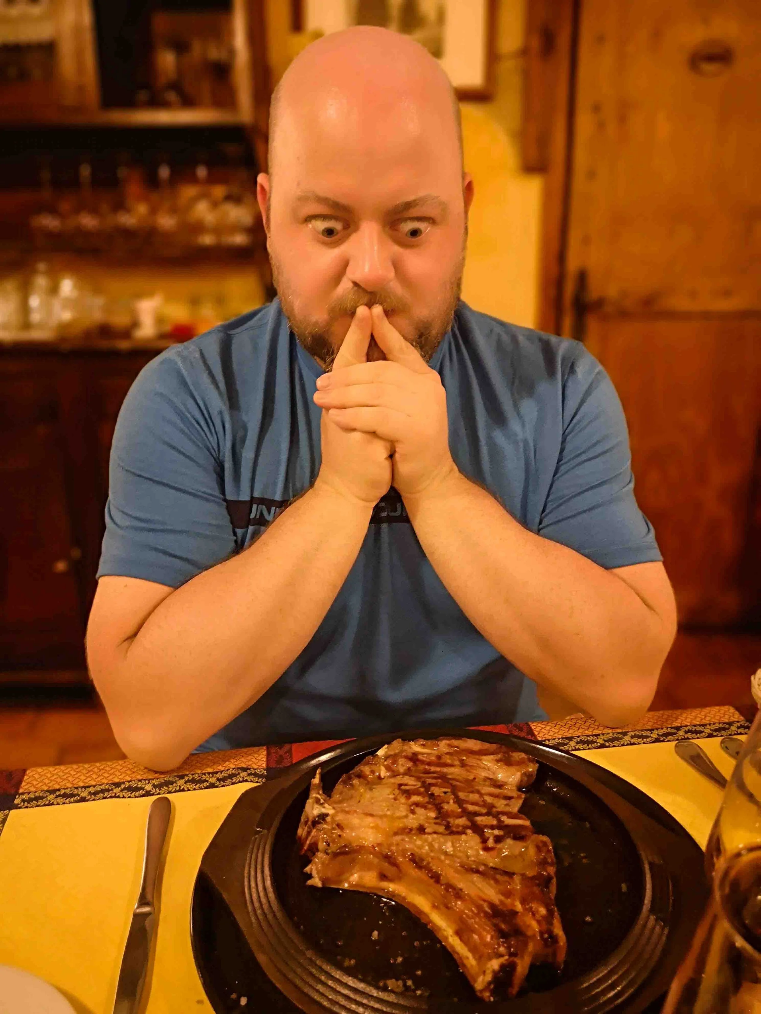 Neil's huge steak dining out in Volterra Tuscany road trip.jpg