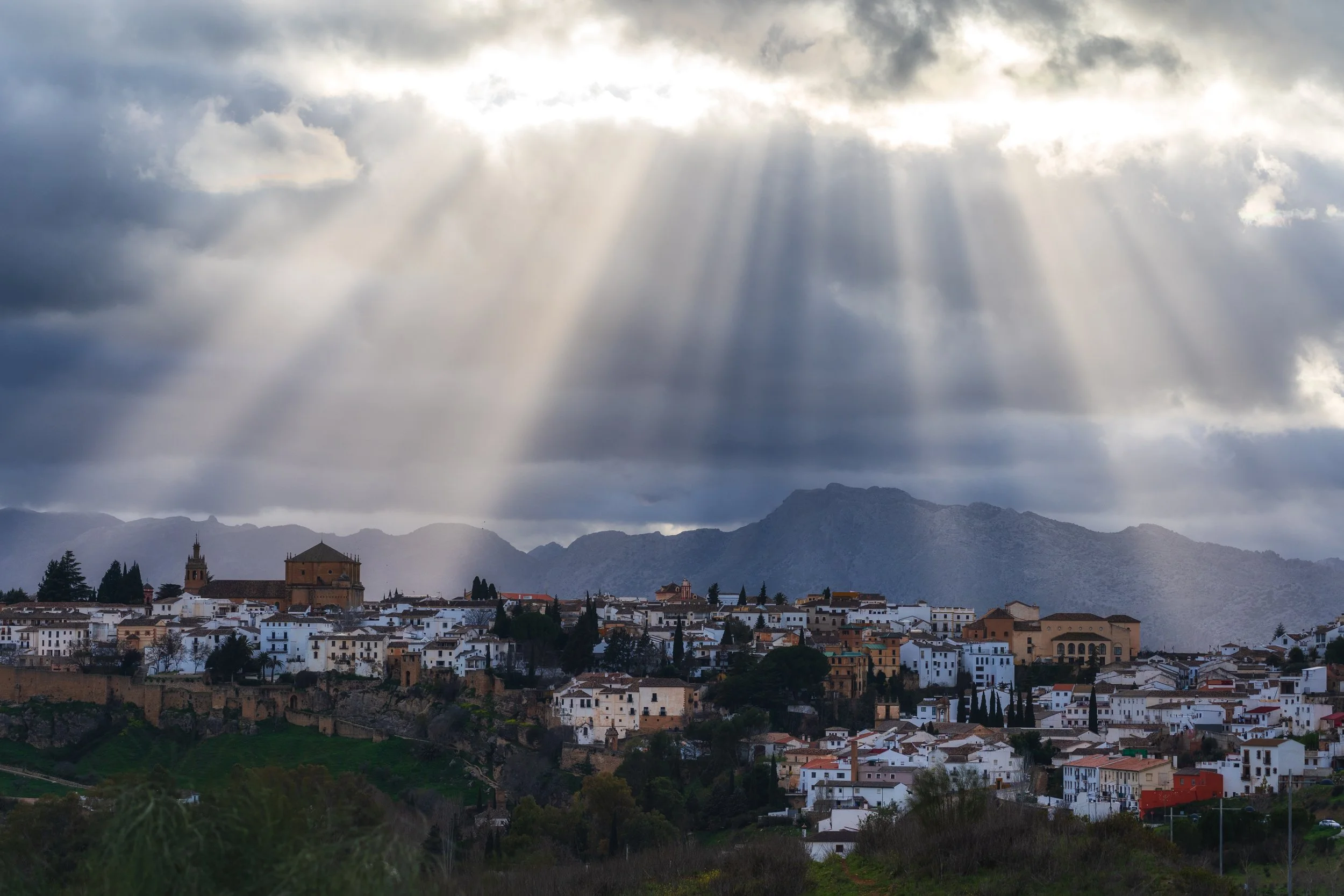 Big sunbeams shining over Ronda
