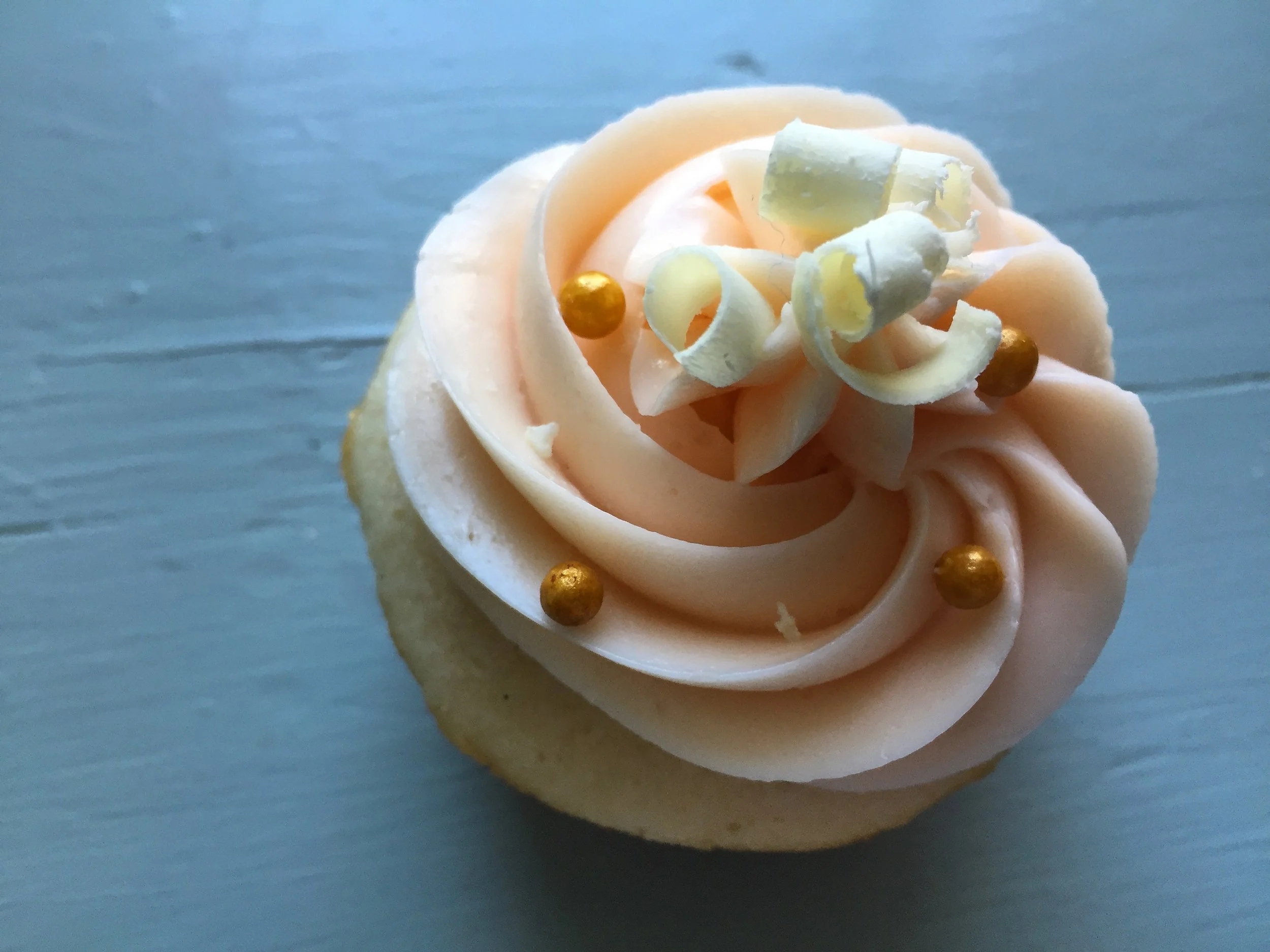 Vanilla Bean Cupcakes with Rose, White Chocolate and Champagne Swiss Meringue Buttercream