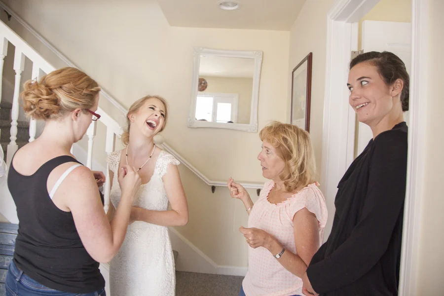 A group of women are smiling and laughing.