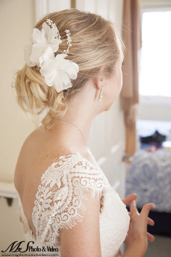 The bride is looking into the distance.
