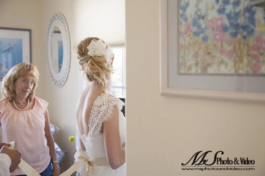 The bride and her mother are looking at each other.