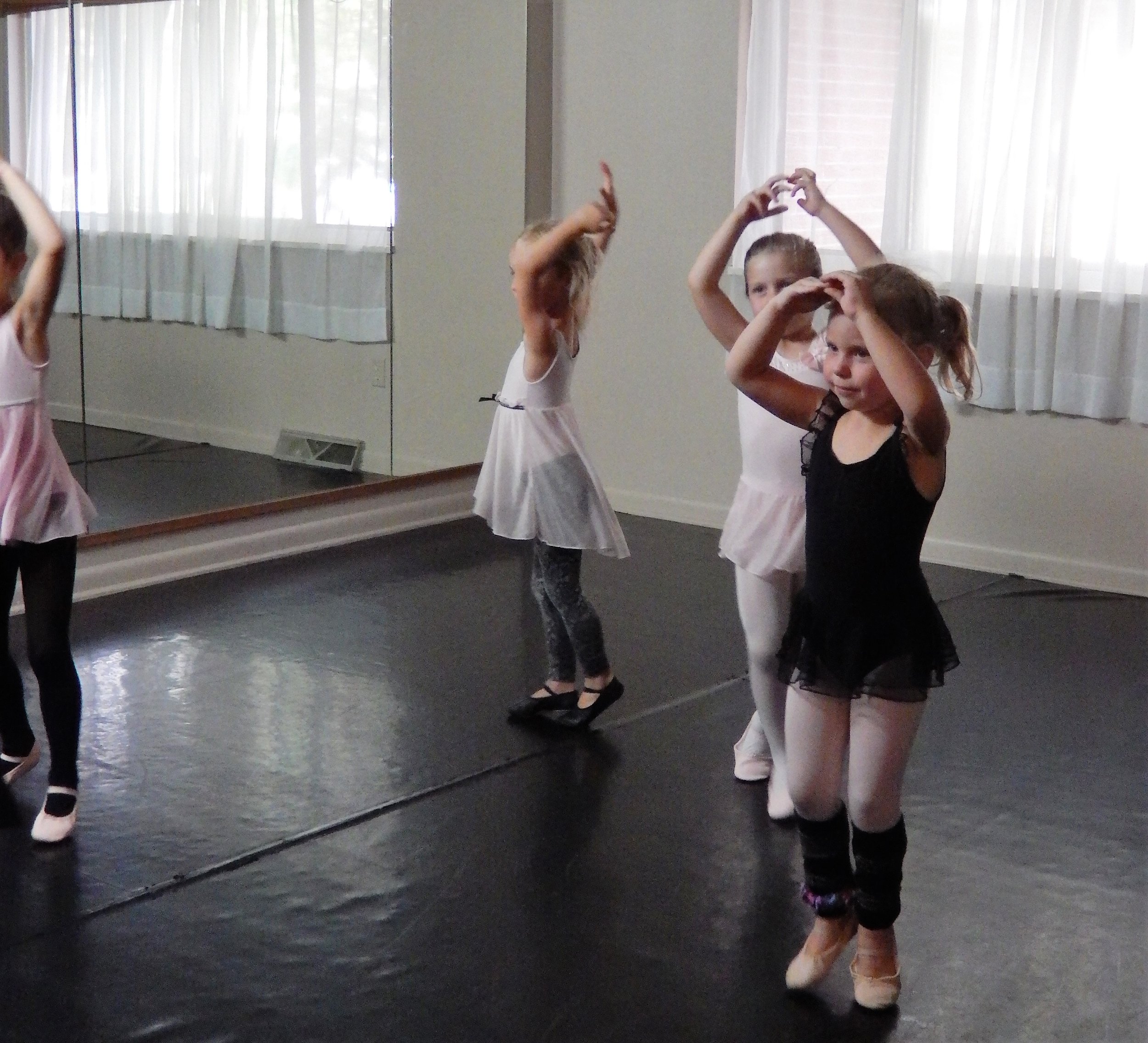 Petite Ballerinas Dancing in a circle