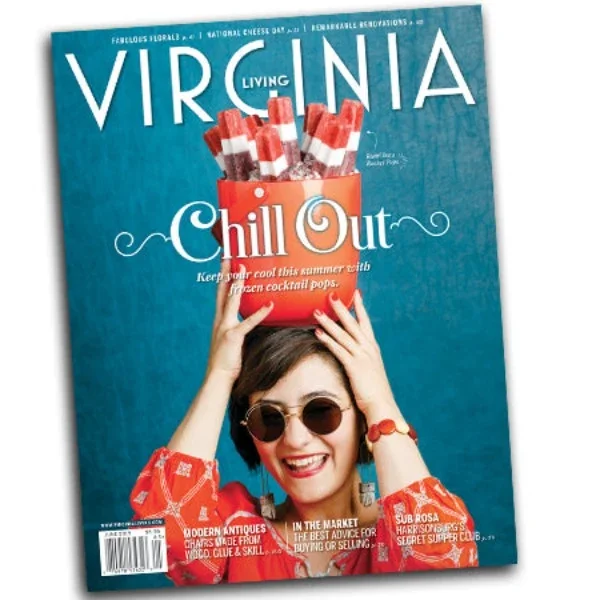 Cover of Virginia Living magazine featuring a woman with short dark hair, sunglasses, and a red patterned shirt holding a red box labeled "Chill Out" with ice pops on her head.