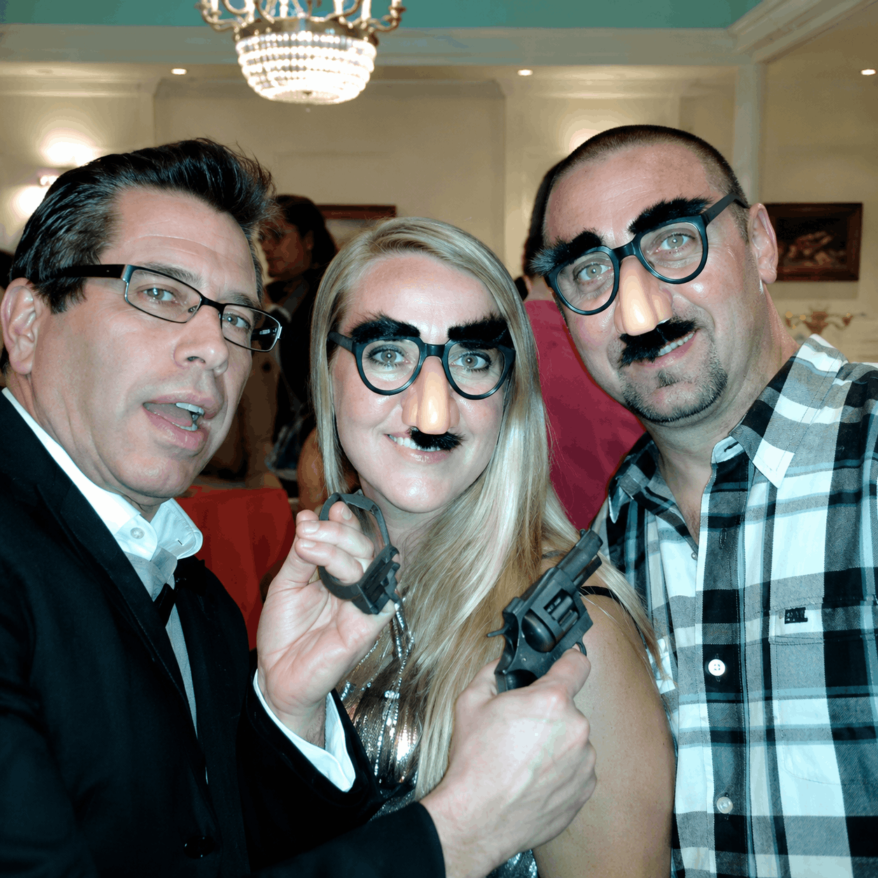Guests having fun at a murder mystery anniversary party