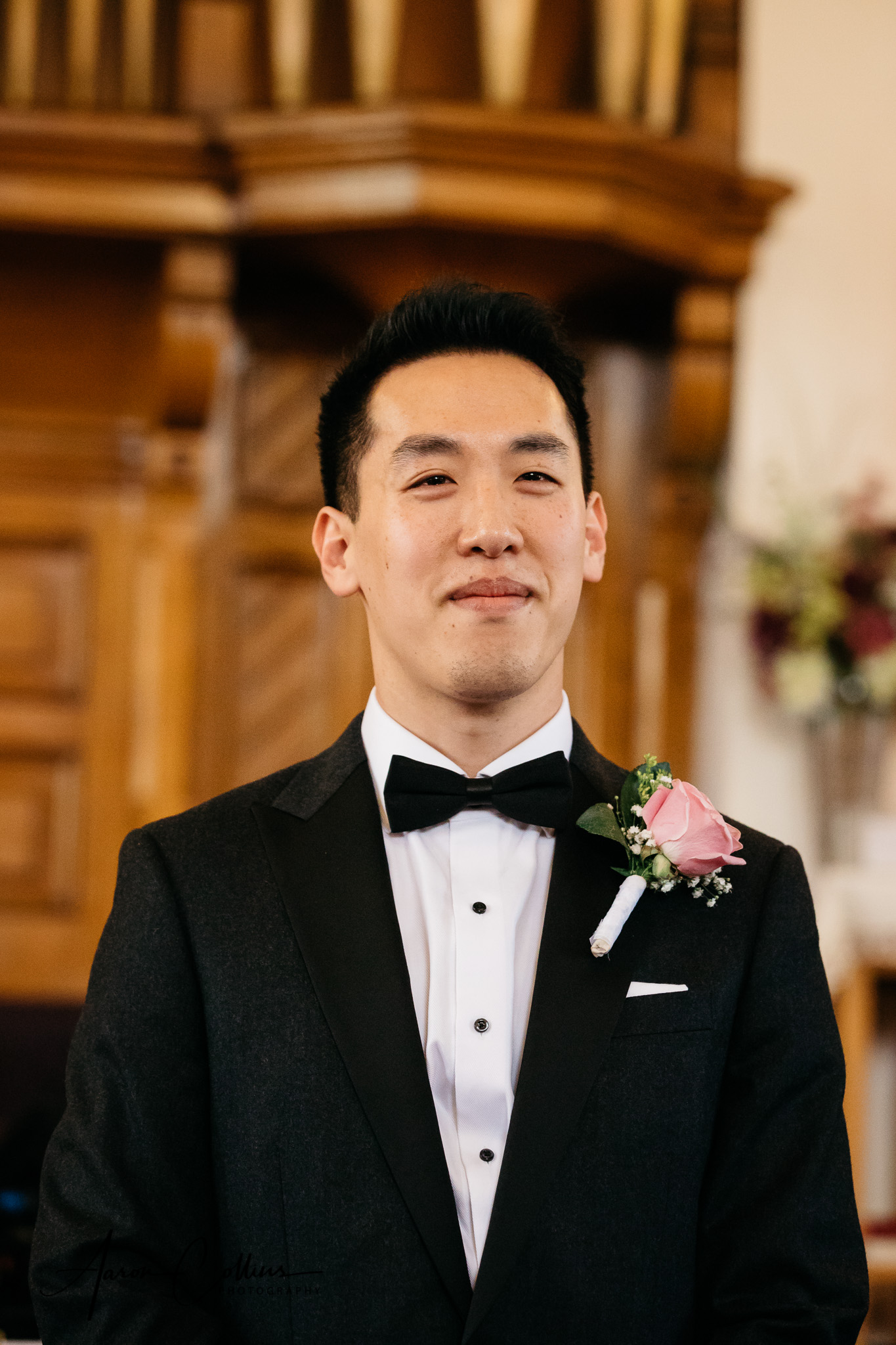 Groom seeing his bride for the first time as she comes down the