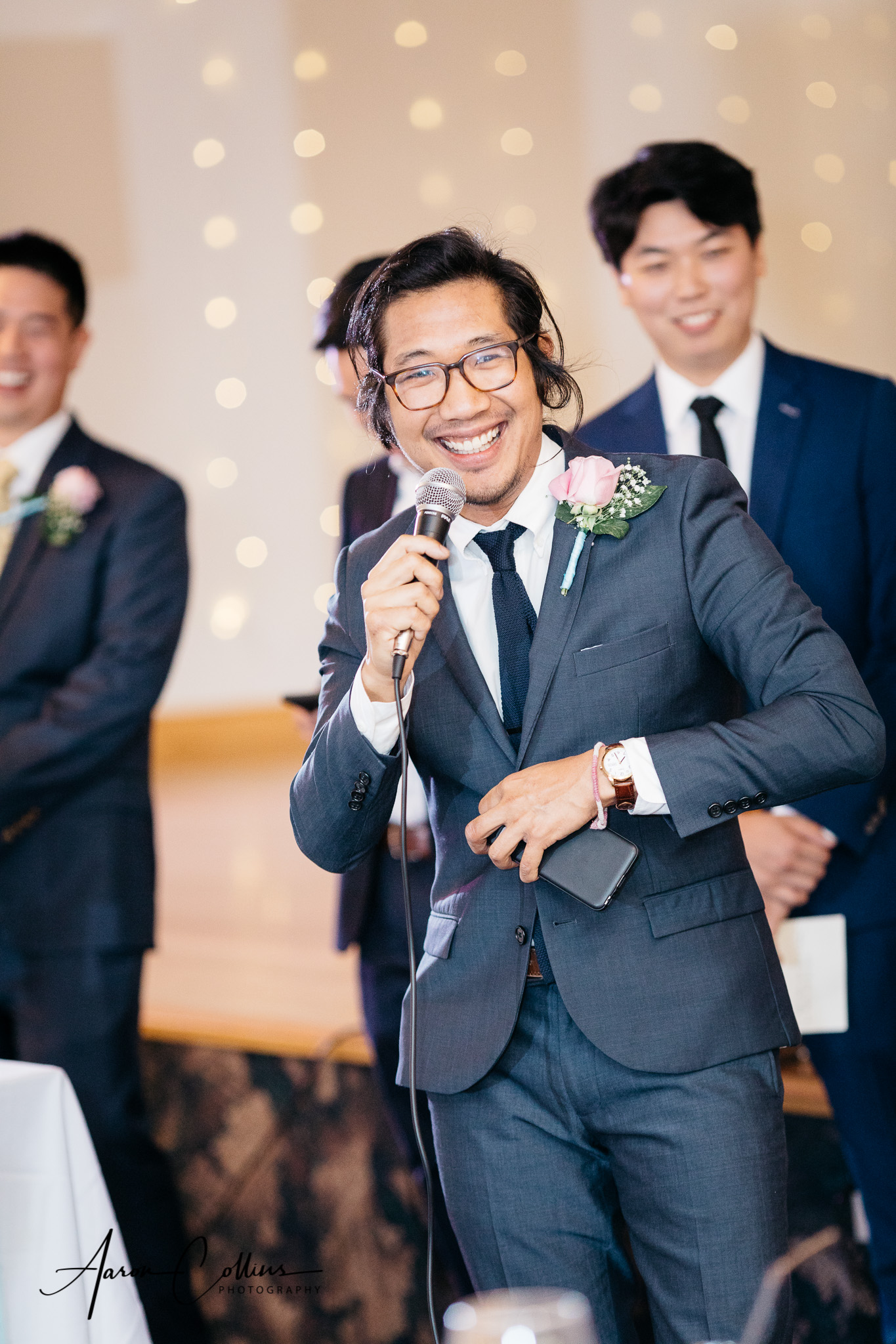 Groomsman gives a toast at the reception