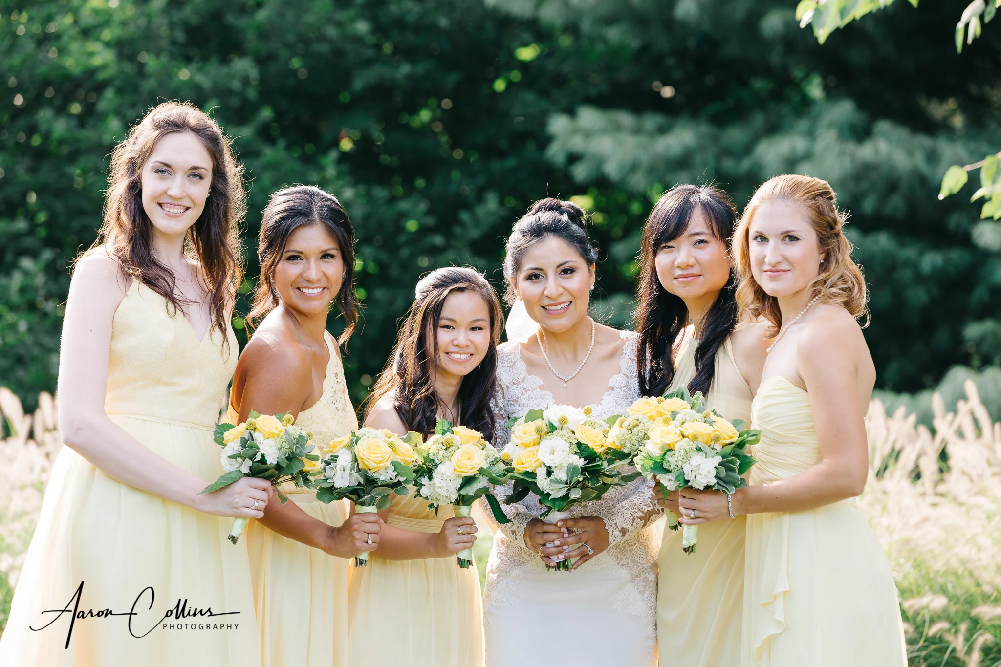 Bridesmaids and bride holding bouquets at Green Hill Park in Worcester MA
