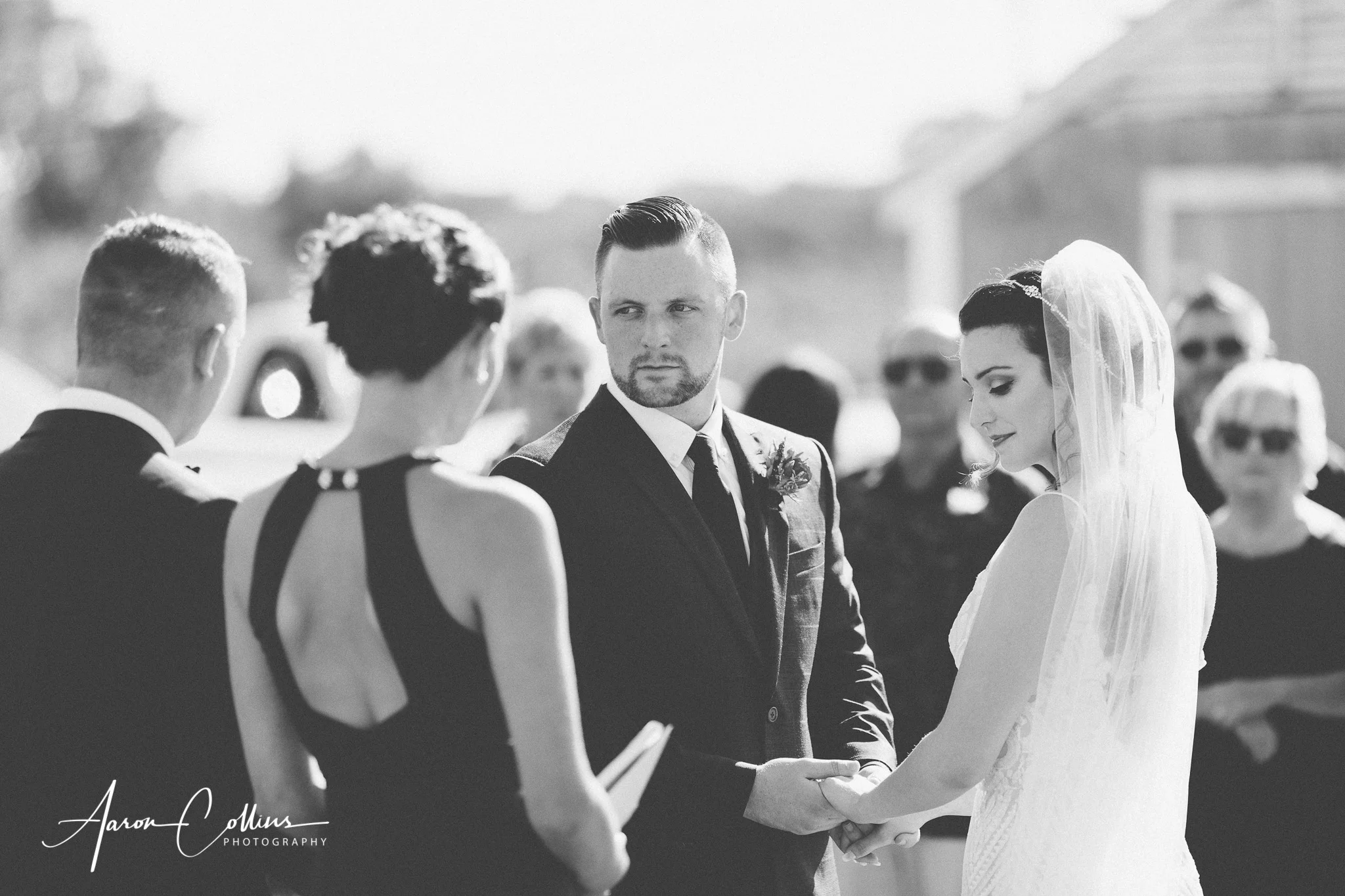 Bride and groom in black and white while they are married at BIMI on Block Island.