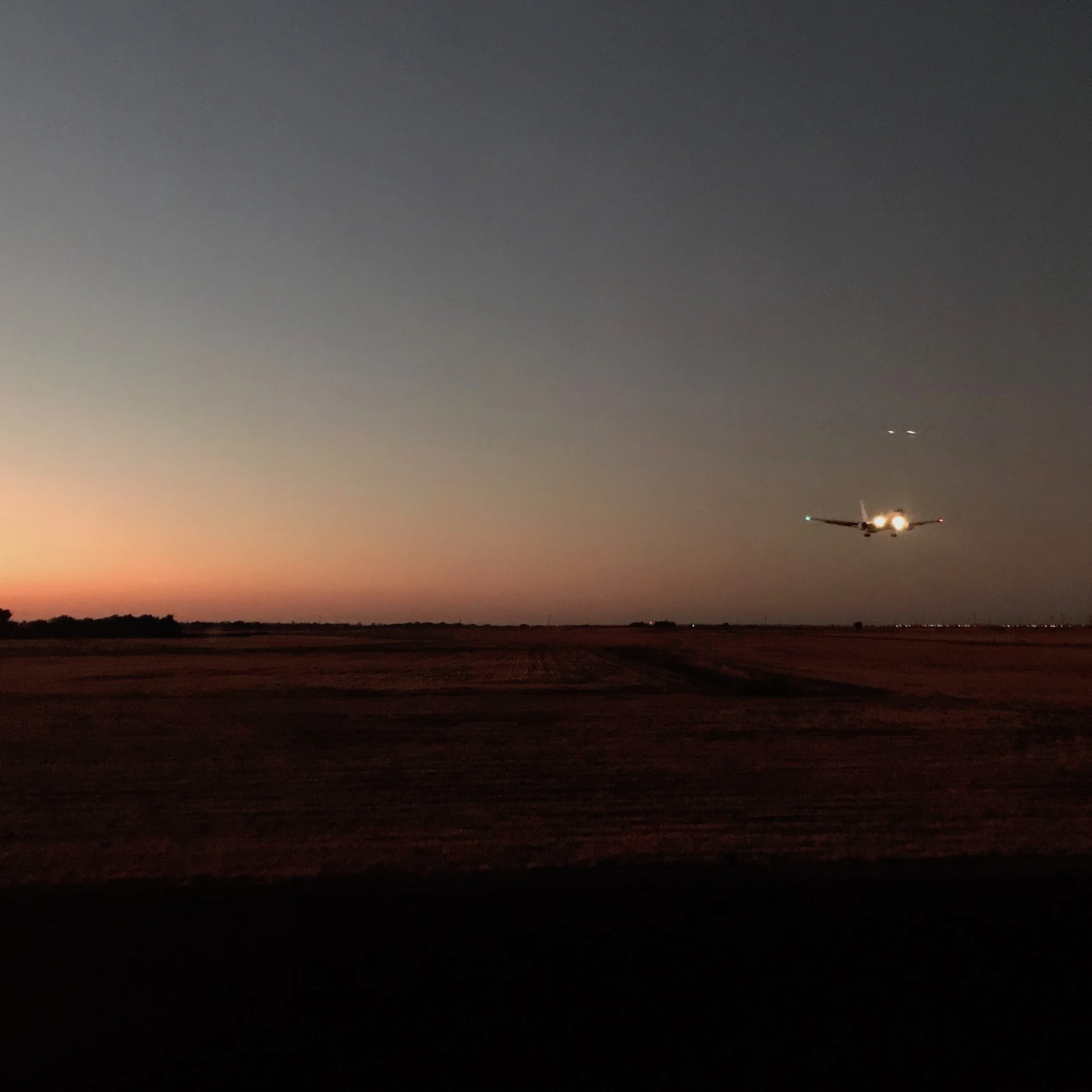 Square thumbnail: Just a photo of a plane landing before we took off back home.