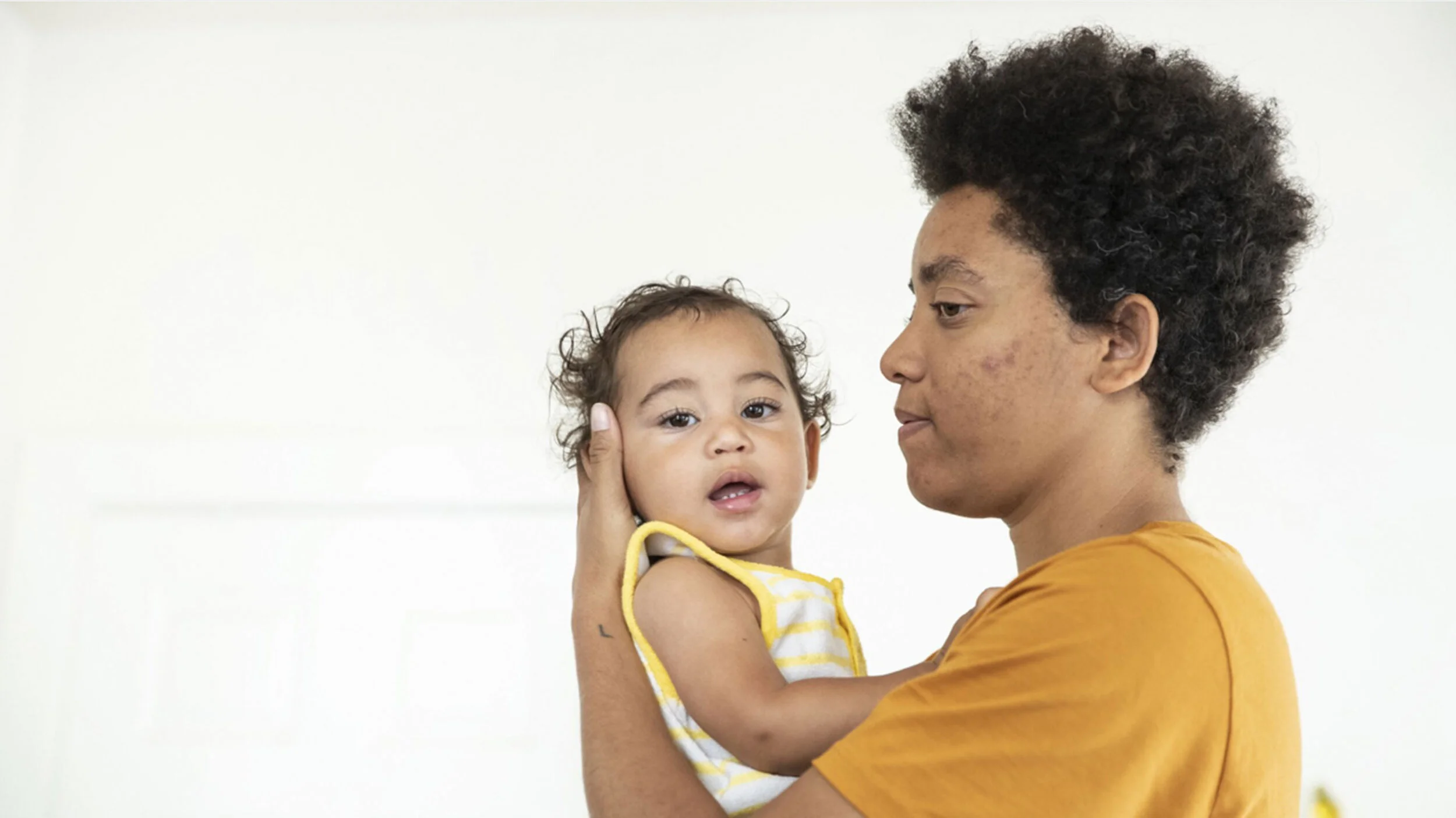 Cropped screenshot of L.A. Times photo from story about LGBTQIA woman raising a child genderless.