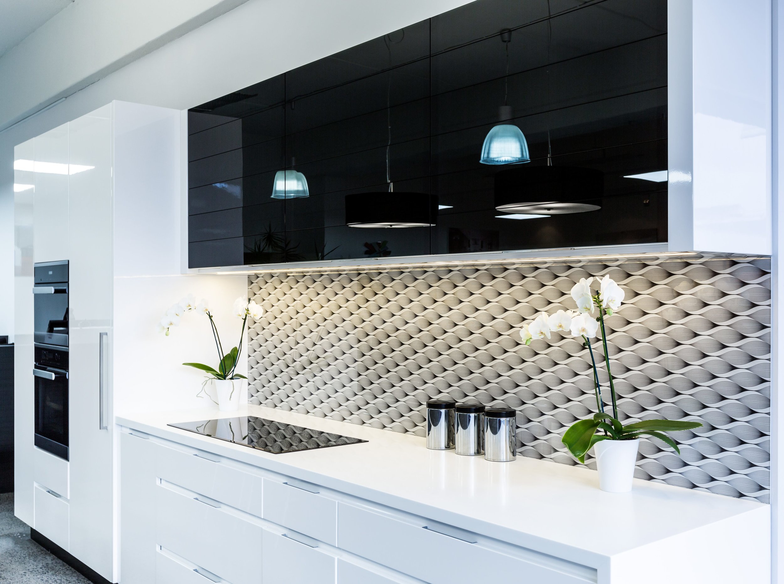 Abstract geometric black and white printed splashback for modern white kitchen