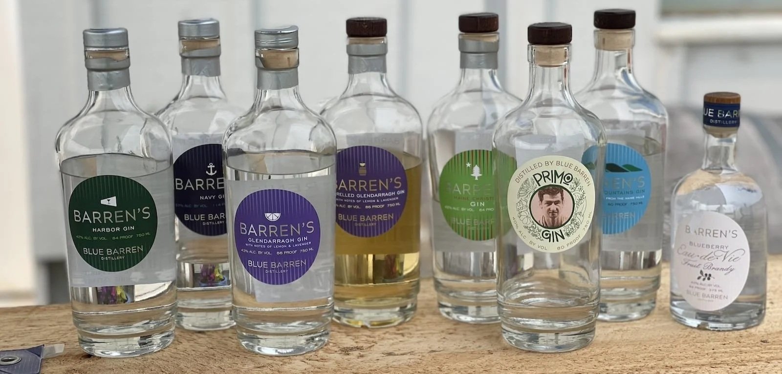Selection of Blue Barren gin bottles and local spirits from Camden Maine