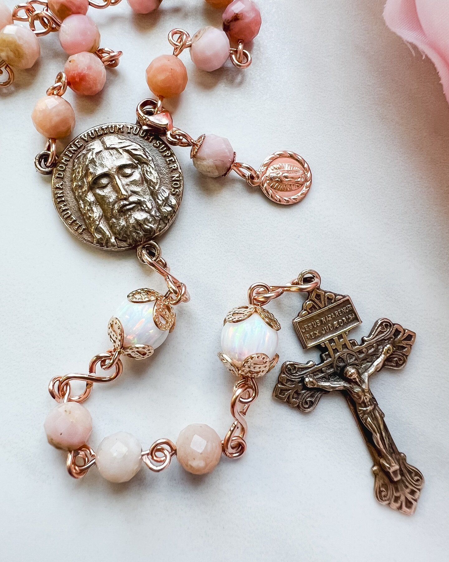Pink and white opal with the Holy Face of Jesus center and Pardon crucifix in bronze. 

Enjoy a discount on all rosaries and jewelry with code LENT24 🩷

#livolsirosaries #catholic #rosary #rosarymaker #catholicbusiness #tradcat #traditionalcatholic 