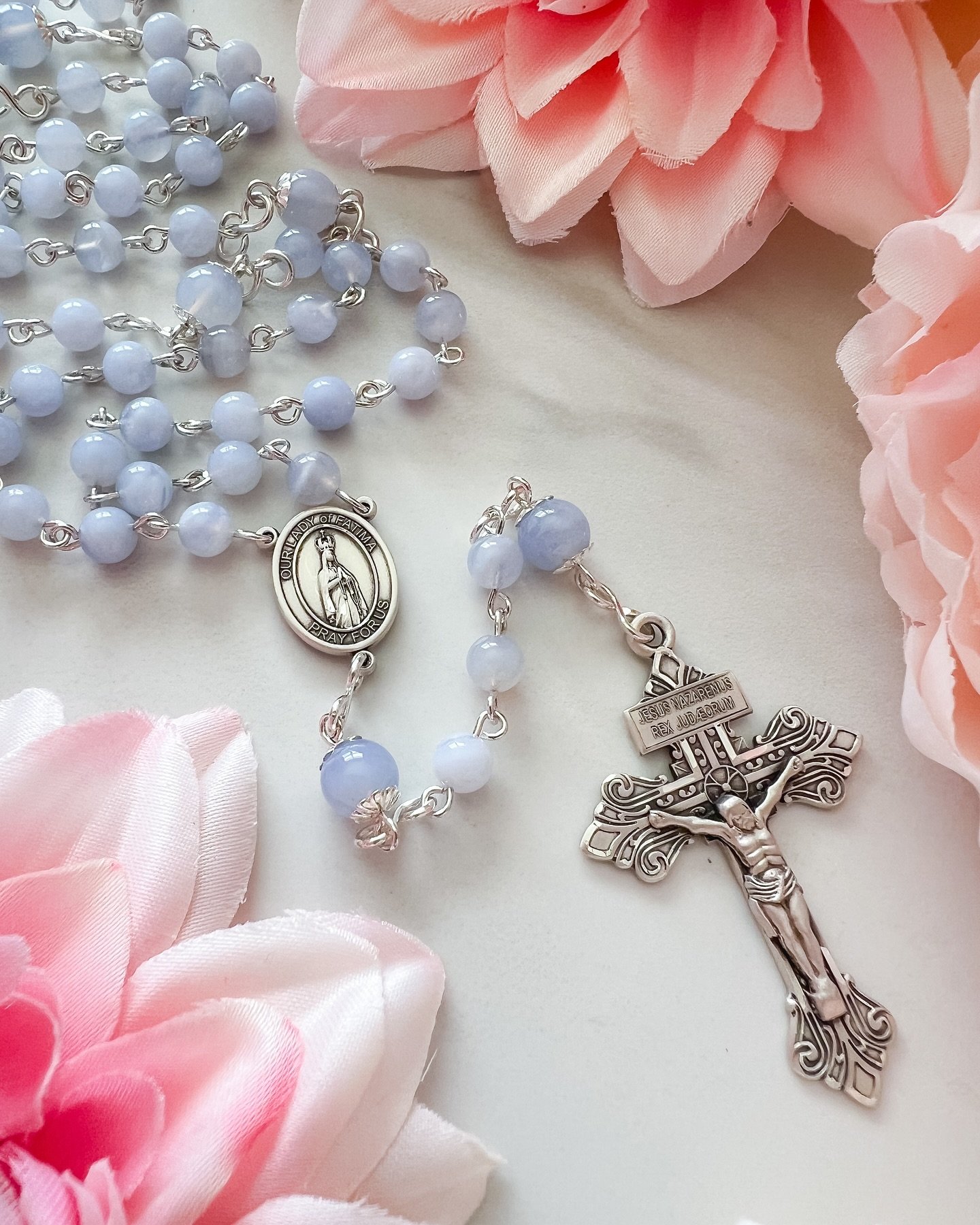 Blue lace agate rosary with Our Lady of Fatima center and Pardon crucifix in sterling silver 💐

We&rsquo;ve made it easy to design a custom rosary on our website! Choose your beads, center, crucifix, and chain from an extensive inventory, and add fu