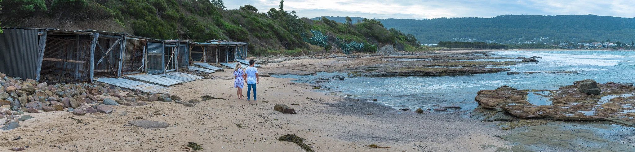 panoramic photo of engagement session on the beach in bulli