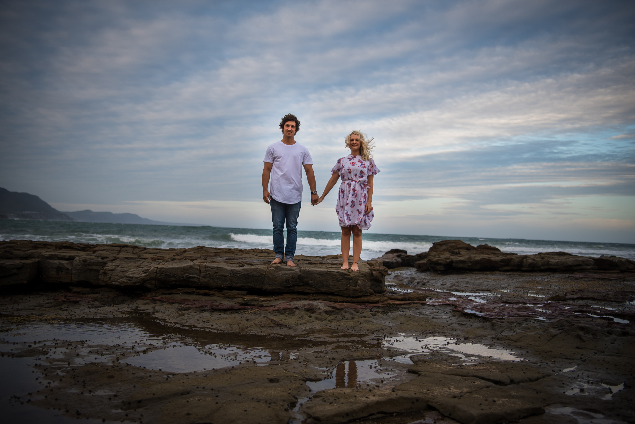 holding hands during an engagement photo session 