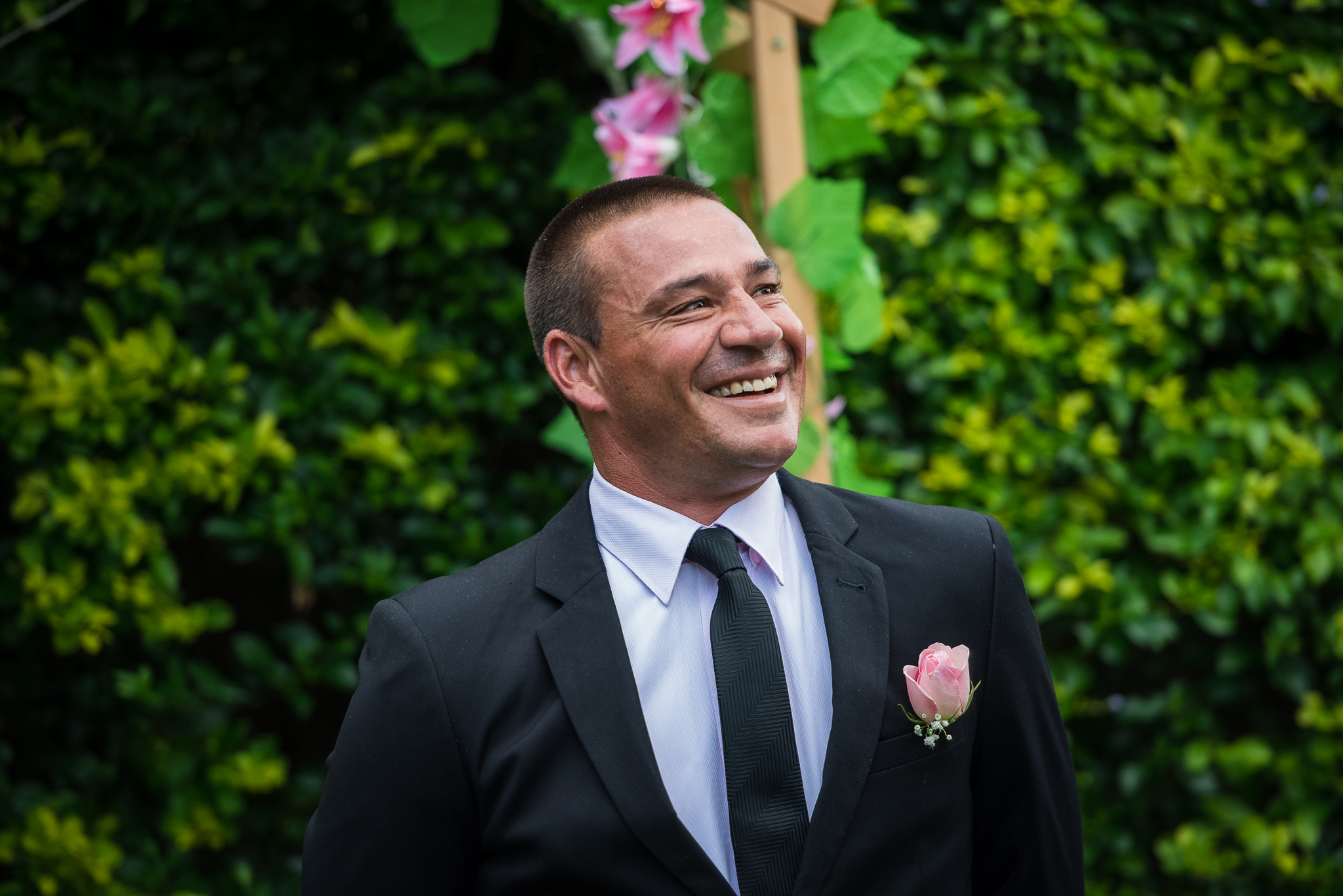 groom waiting at the end of the aisle