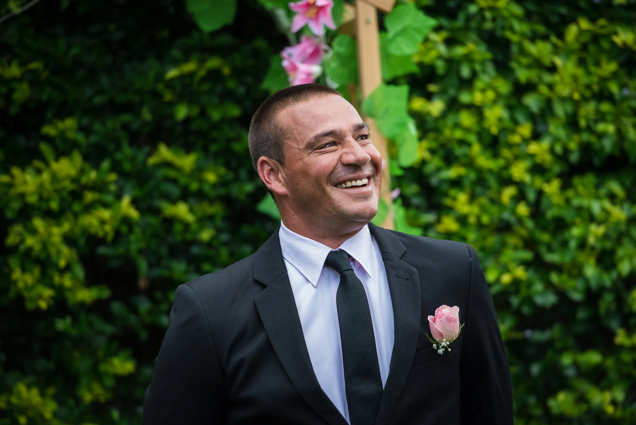 groom waiting at the end of the aisle