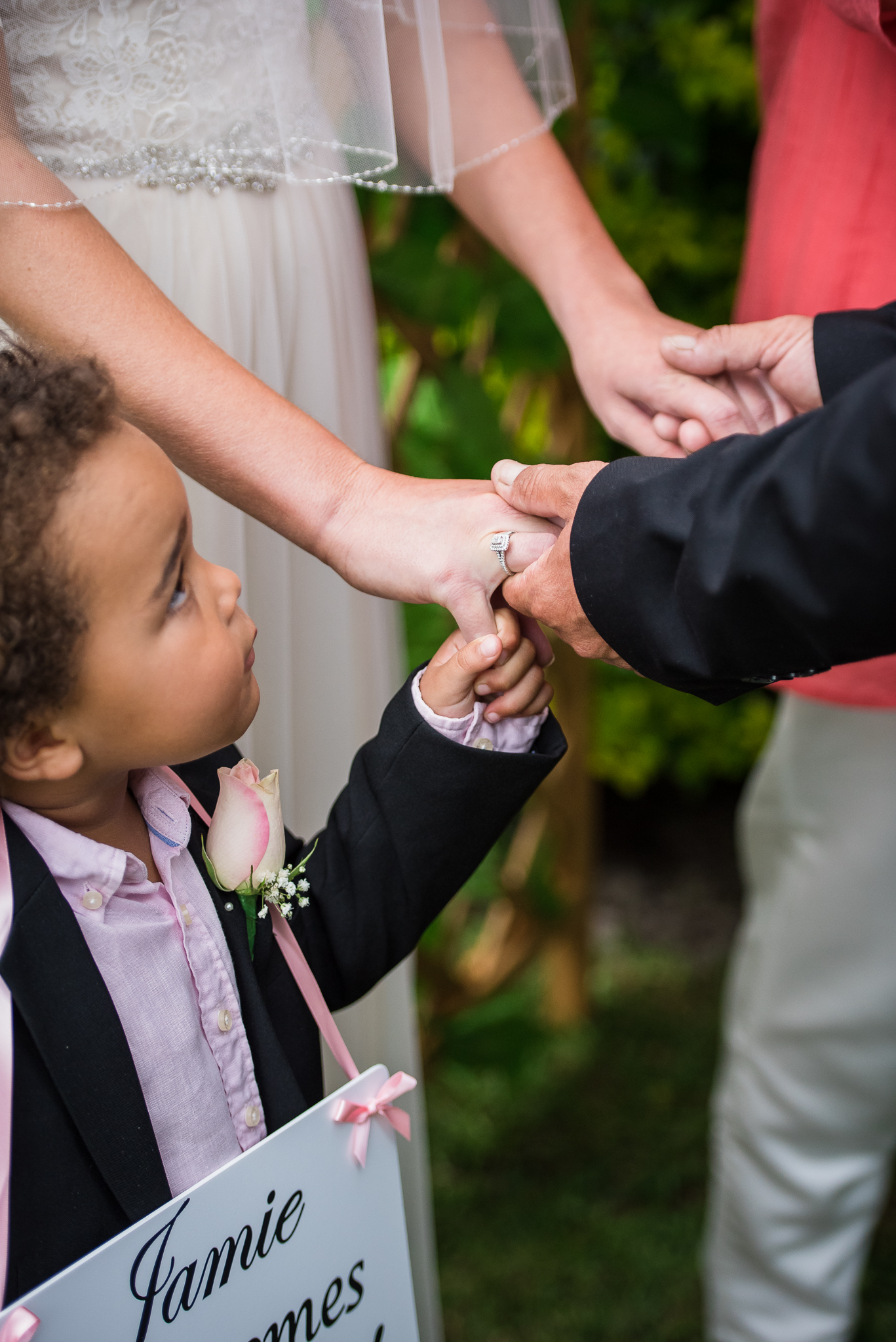 bride, groom and paige boy during the wedding ceremony