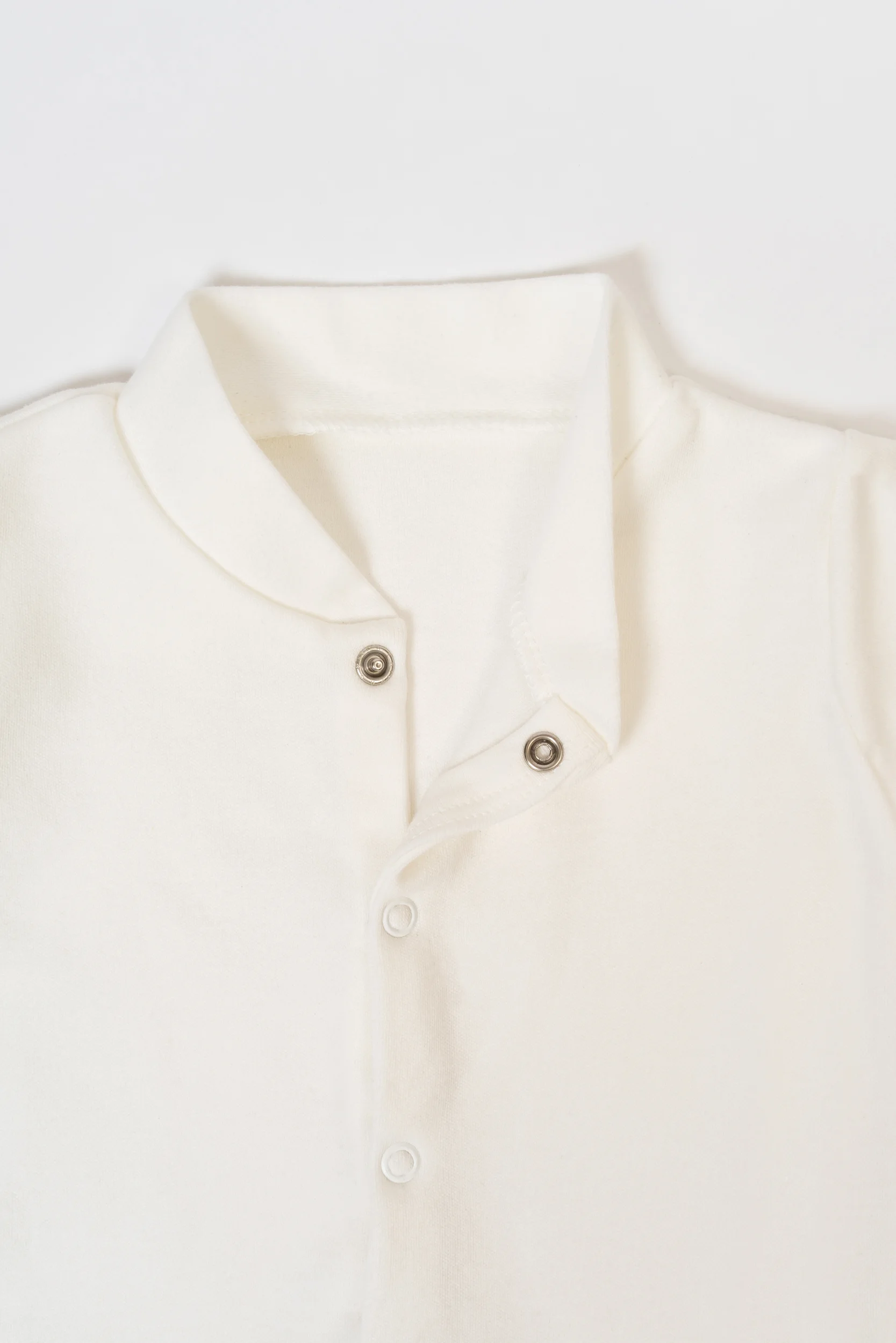 collar detail of Oya Organic Cotton baby sleepsuit