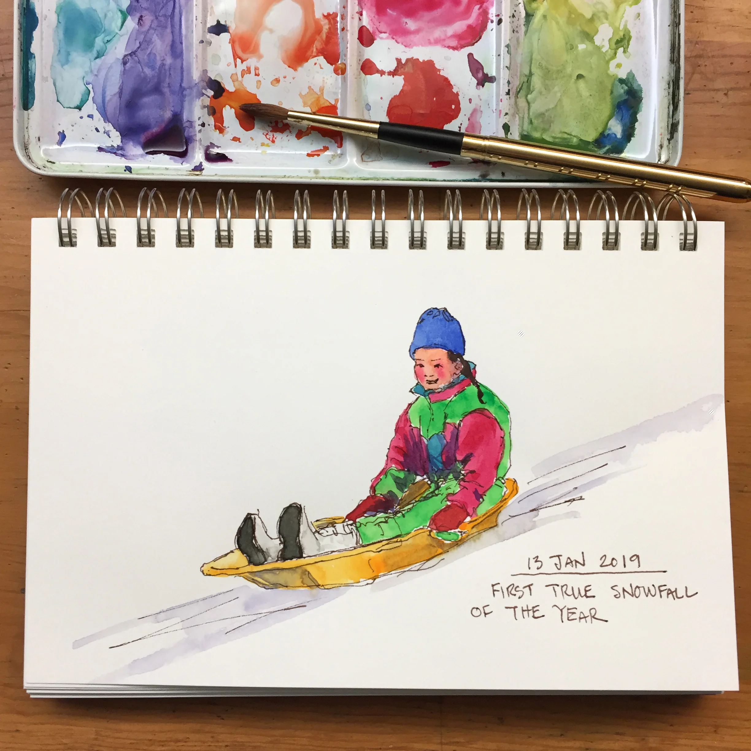 Day 13: First snow of the year. Naomi sledding