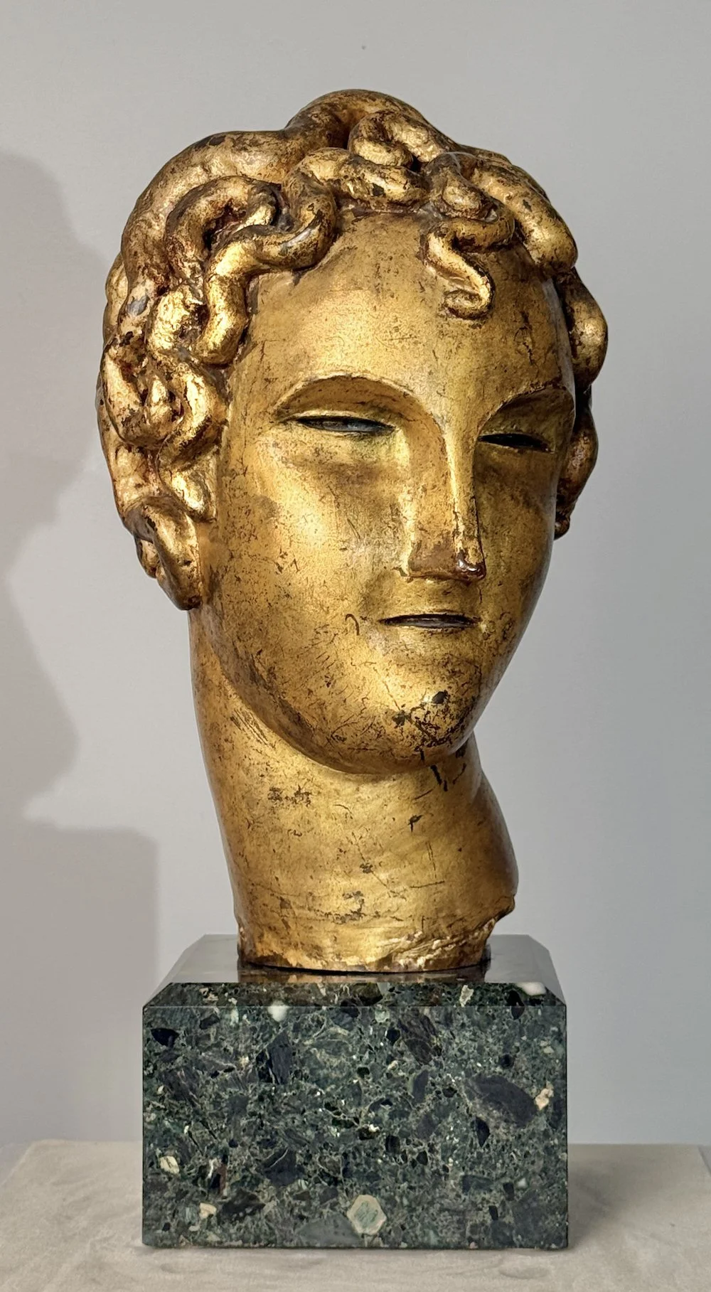   Elie Nadelman  (1882-1946)  Head of a Boy , c. 1906 16 ⅝ H. x 10 ¼ W. x 11 ½ D. inches Bronze, parcel gilt surface Original, period marble base 