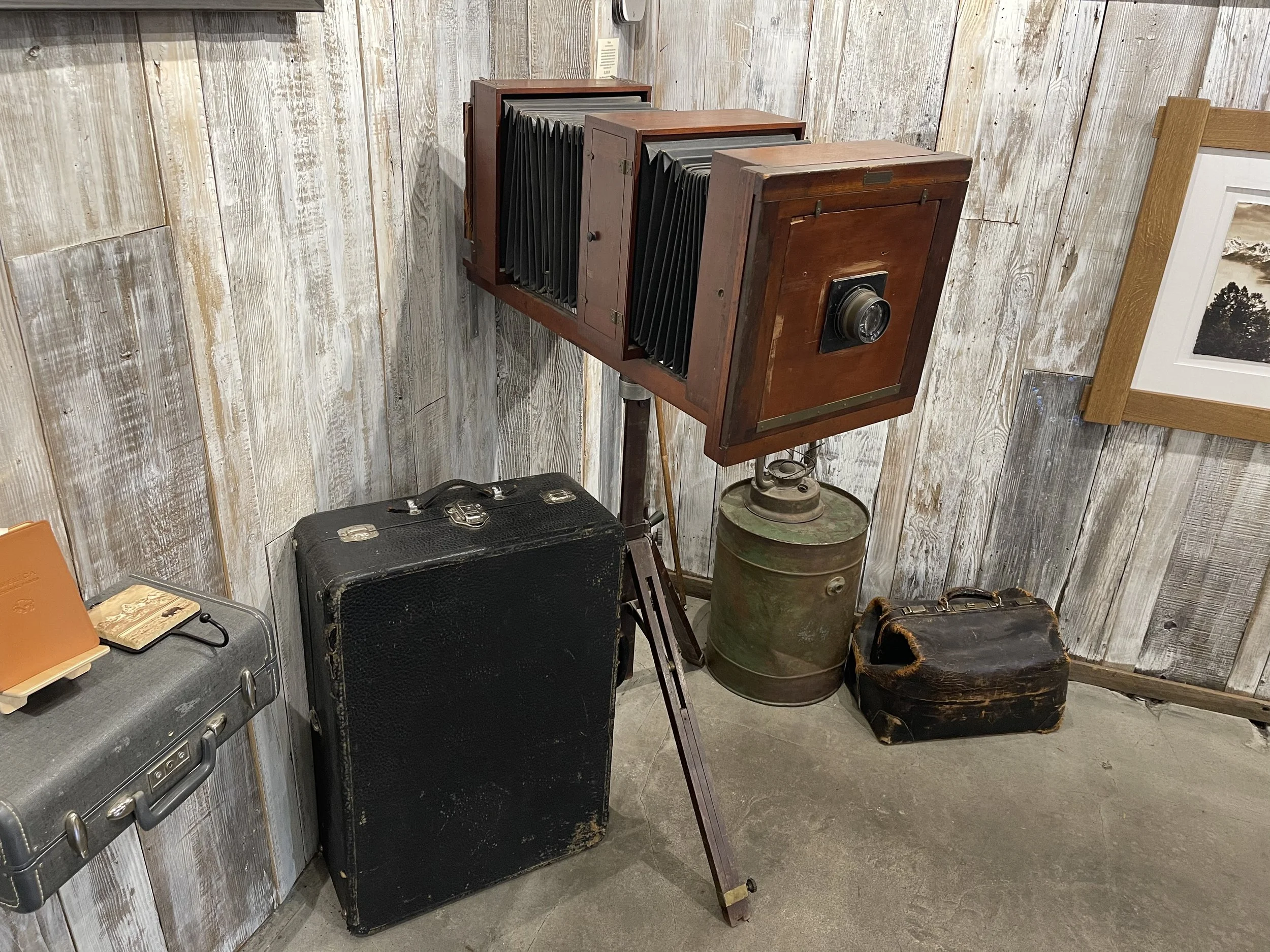 Vintage large format wooden camera on tripod displayed in Jackson Hole shop