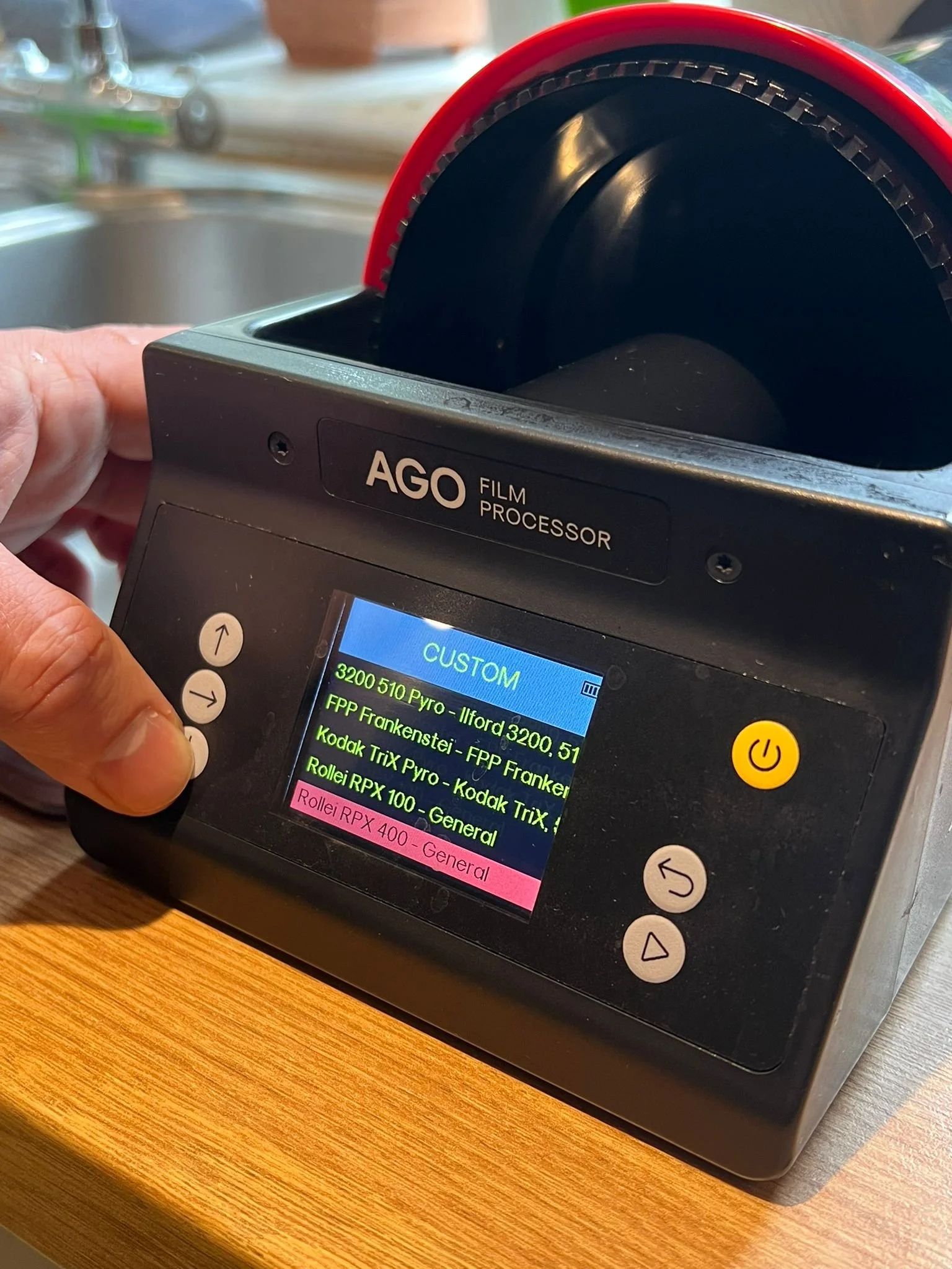 AGO film processor showing custom program list for 510 Pyro, ECN-2, and C-41 film development.