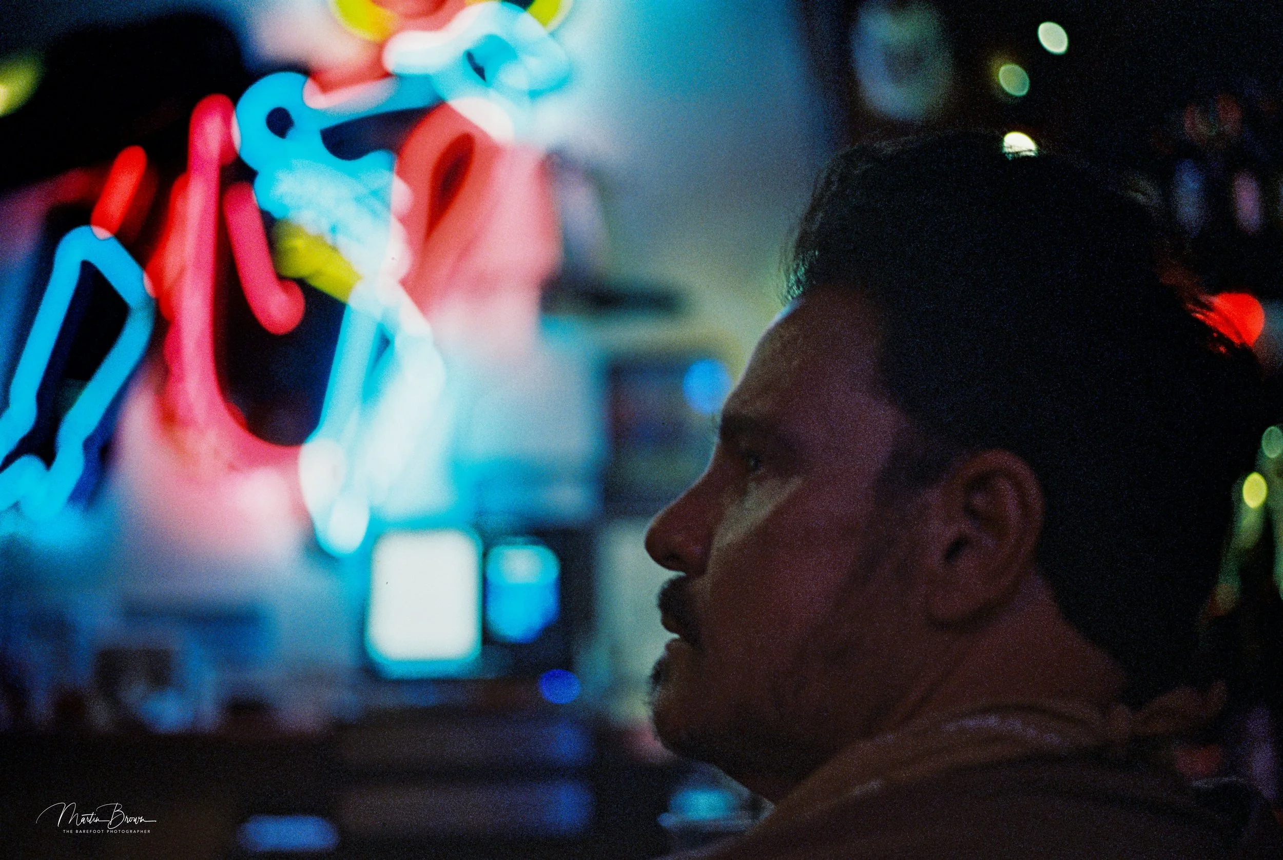 Portrait of Craig Sheffer in Las Vegas neon light shot on Kodak Vision3 500T film showing rich colour and cinematic tone.