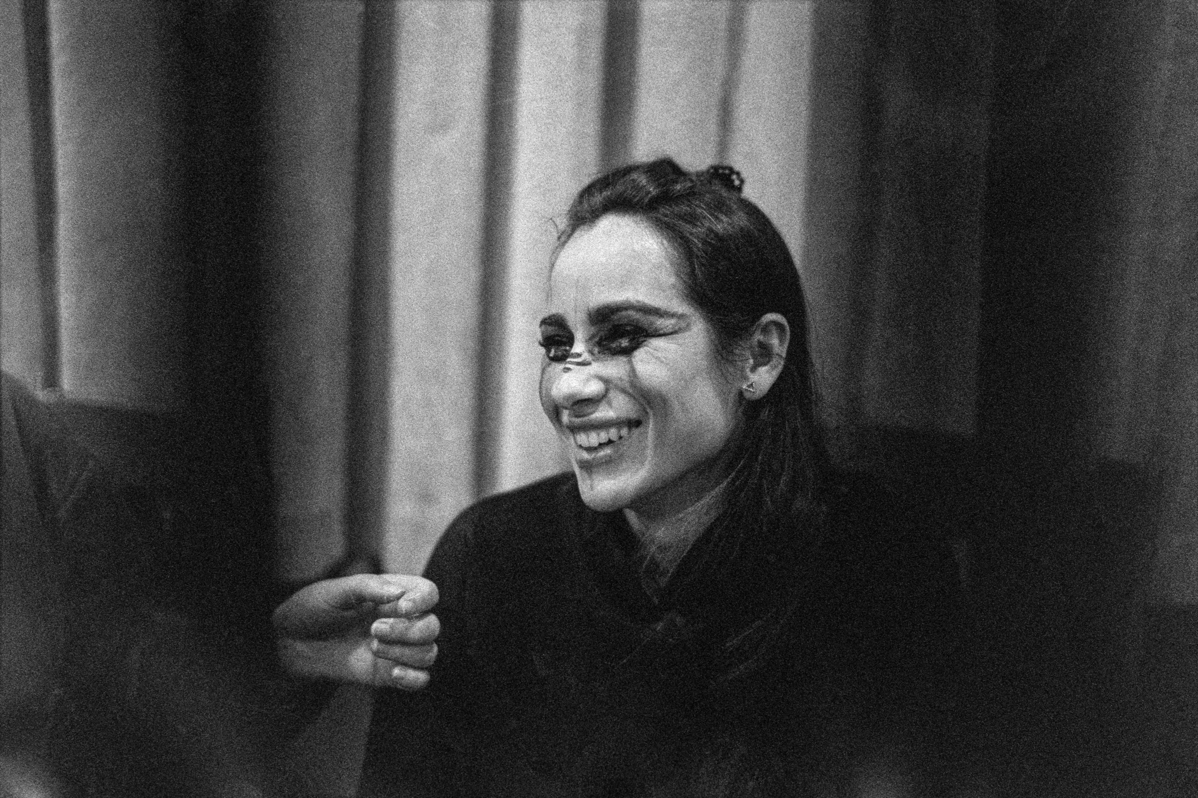 Model preparing test makeup, photographed on Ilford Delta 3200 with the Voigtlander 40mm f/1.2 and developed in 510 Pyro.