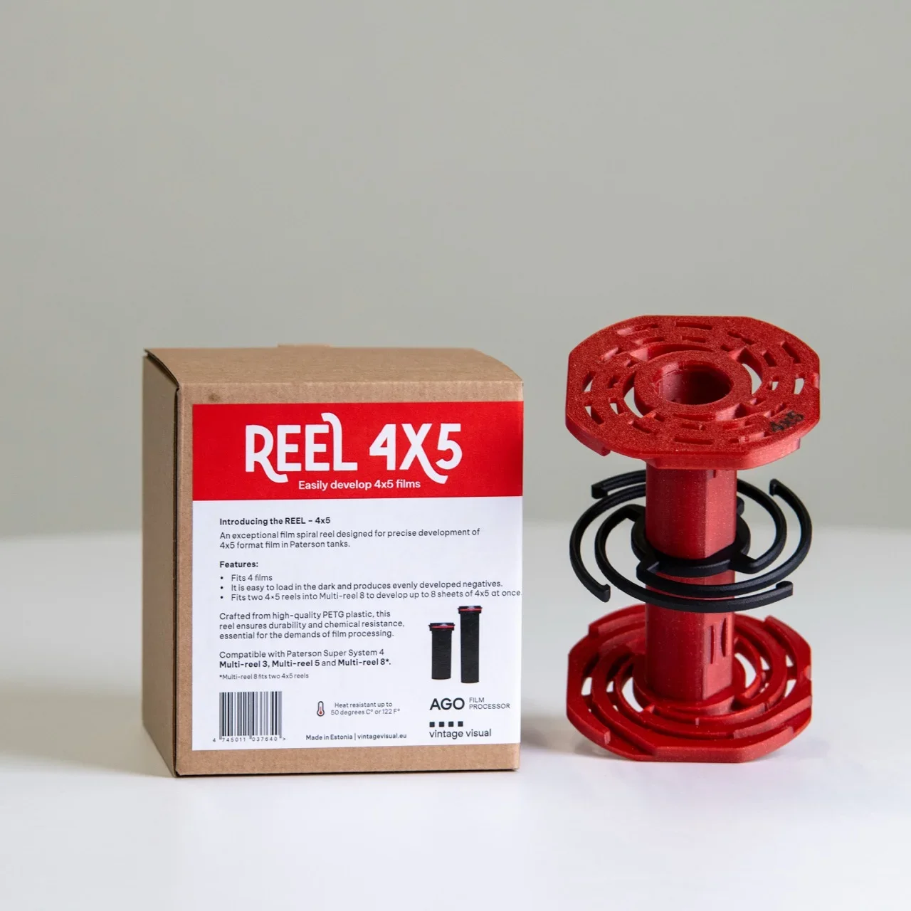 AGO 4×5 reel shown with packaging, illustrating the upcoming transition to a rotary, compensated large-format processing workflow designed for repeatability, long development times, and location-based use.