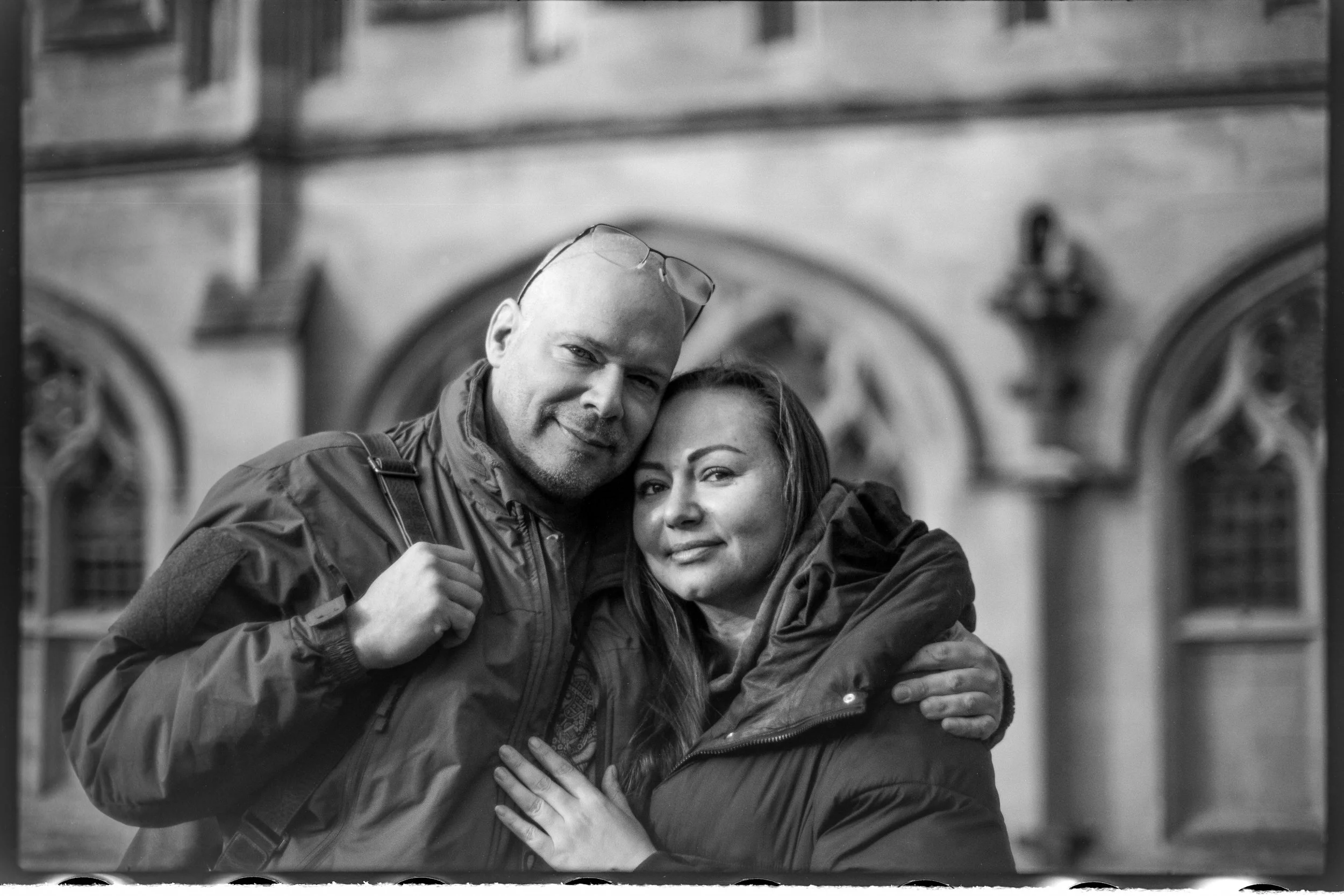Couple standing together in Bath, photographed on Babylon 13 at ISO 6 with a Voigtlander 50mm f/1.1 and developed in 510 Pyro.