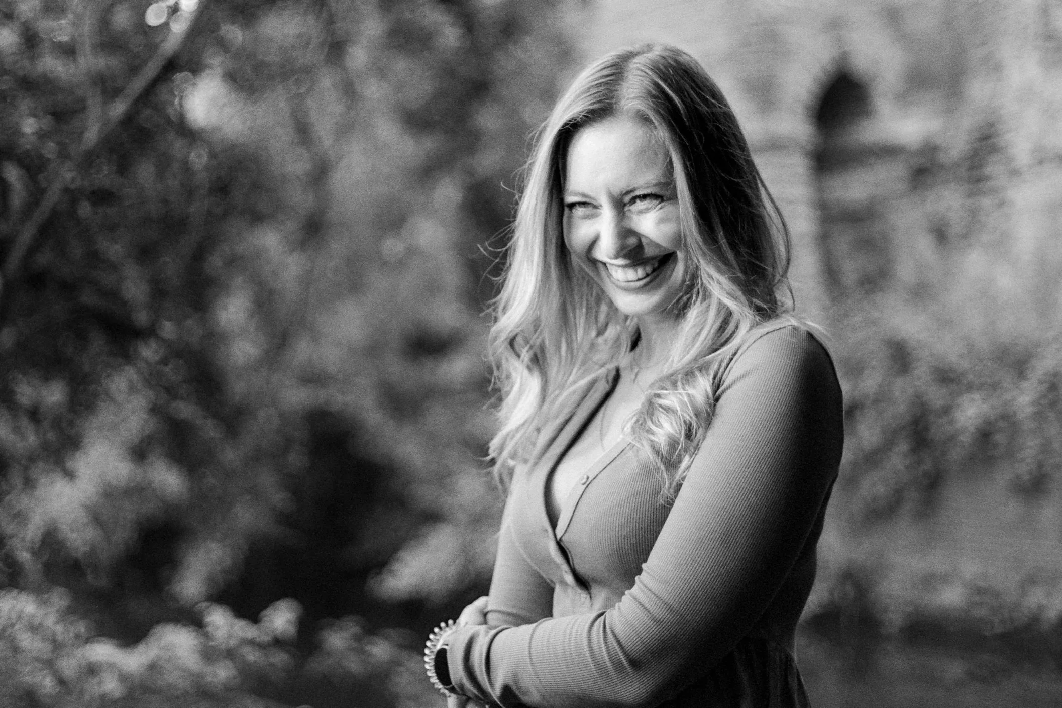 Black and white portrait of a smiling woman outdoors, photographed on film and used to illustrate 510 Pyro black and white development.