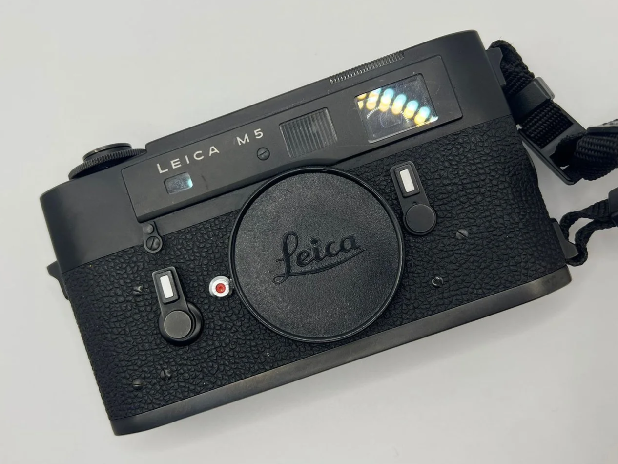 Front view of a black chrome Leica M5 rangefinder camera, illustrating the design and construction details discussed in the article on Leica’s craftsmanship and engineering changes in the 1970s.