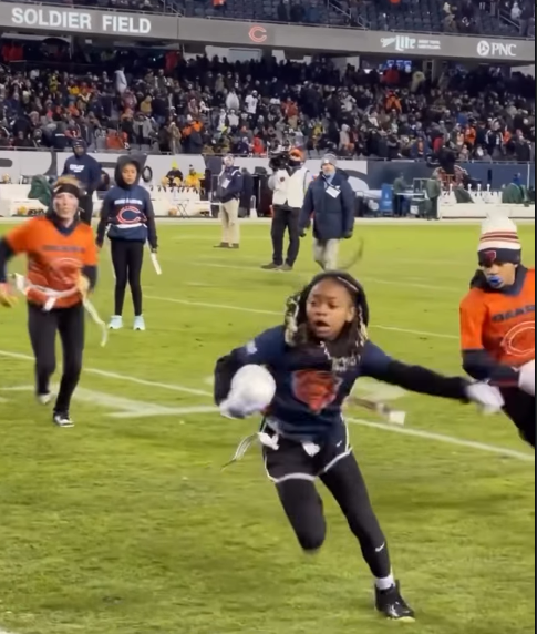 Rockford Park District flag football teams scrimmage at halftime of Bears vs. Packers playoff game