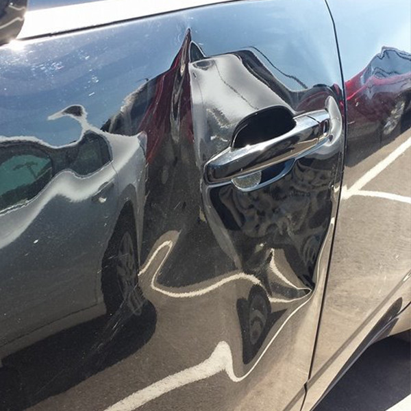Copy of 2 - Multiple Dents on car door before treatment