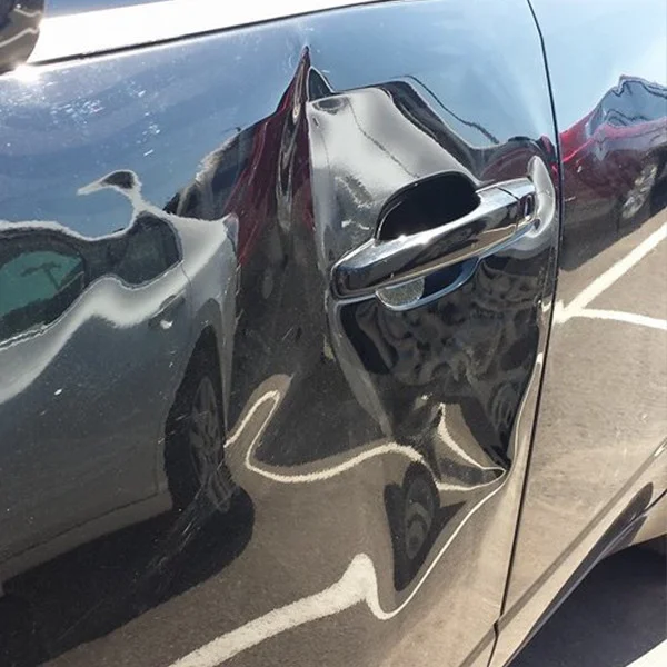 Copy of 2 - Multiple Dents on car door before treatment