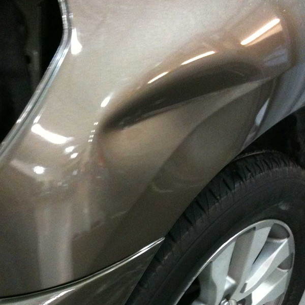 Copy of 3 - dent on car fender before treatment